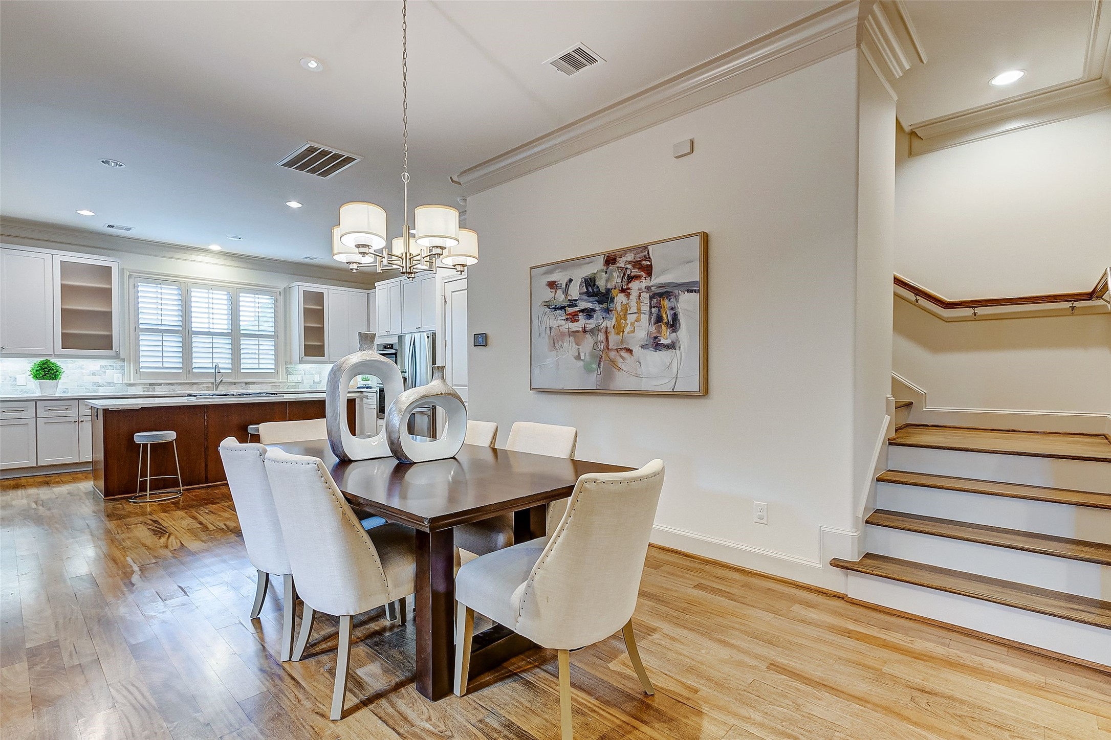 Elegant dining room seamlessly connects to the kitchen, offering effortless convenience for serving meals and entertaining guests.