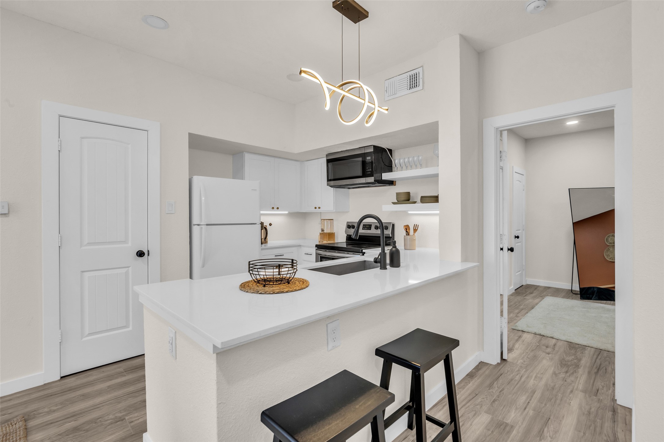 A full view of the kitchen highlights its efficient layout and practical design.