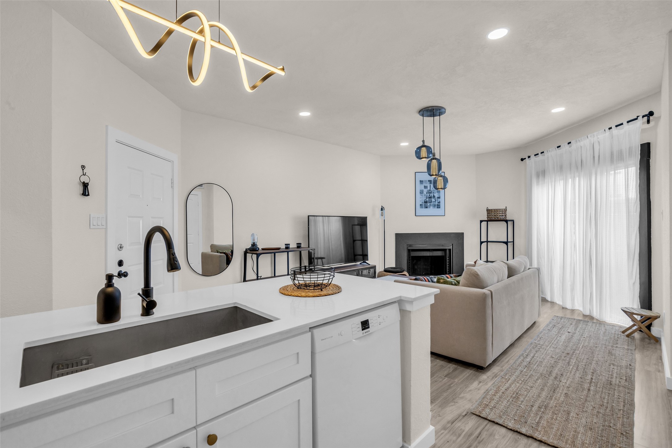Adjacent to the living room is a compact, functional kitchen designed to make the most of the space.