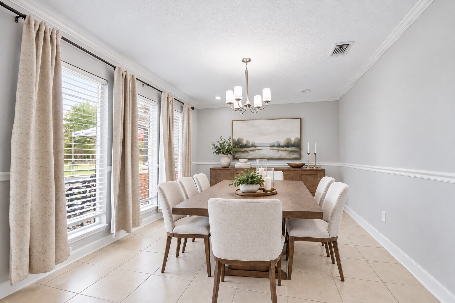 The dining area offers a bright, inviting space for meals, framed by large windows overlooking the front yard. Virtually staged. The dining area offers a bright, inviting space for meals, framed by large windows overlooking the front yard. Virtually staged.