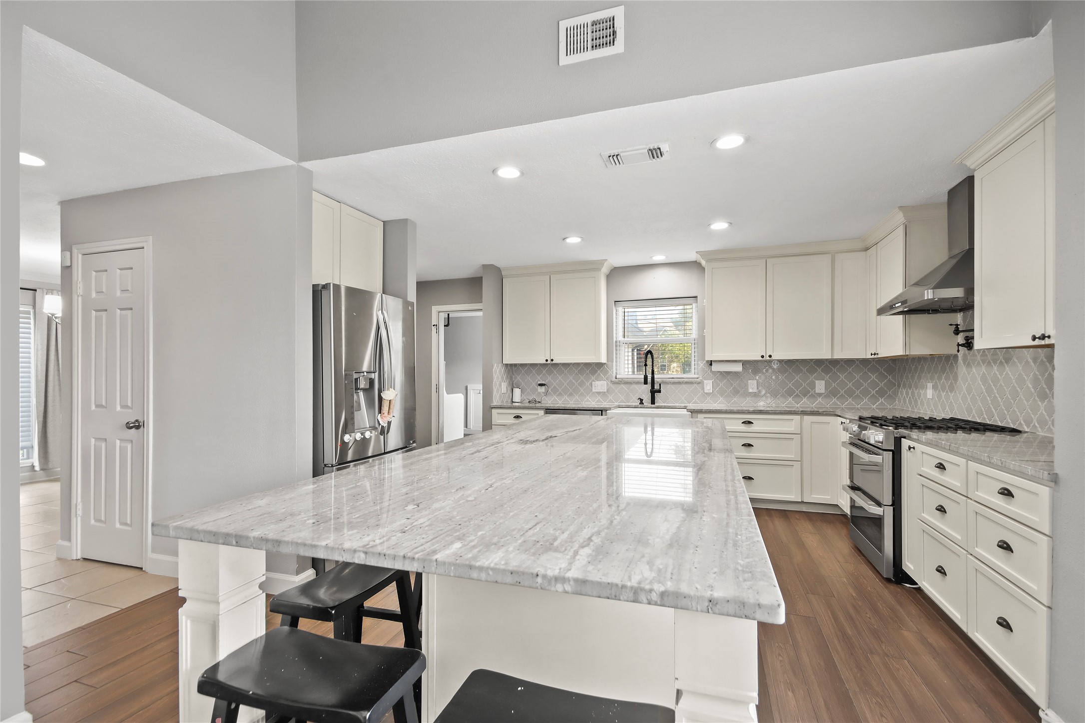 The kitchen is a showstopper, featuring a oversized granite island with bar seating and stainless steel appliances. The kitchen is a showstopper, featuring a oversized granite island with bar seating and stainless steel appliances.