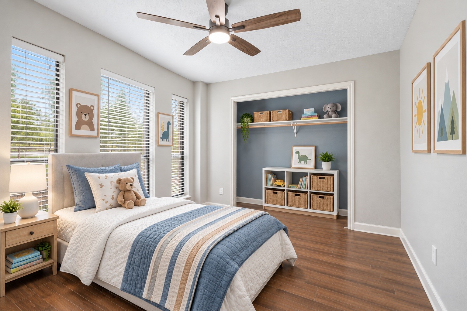 A bright secondary bedroom offers tall windows with serene views and a spacious closet. Virtually staged.