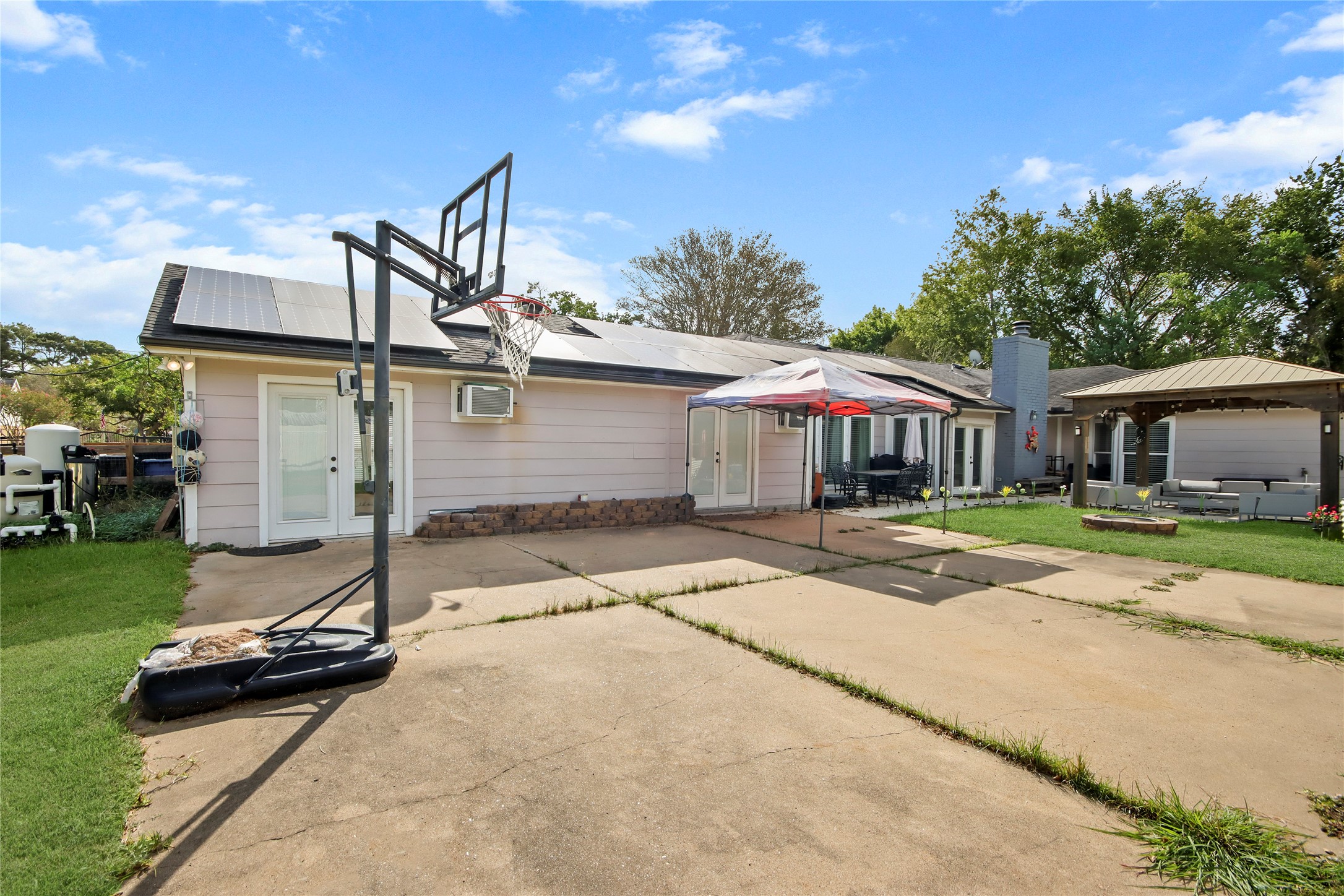 A private basketball court gives this home even more room to play and stay active outdoors.