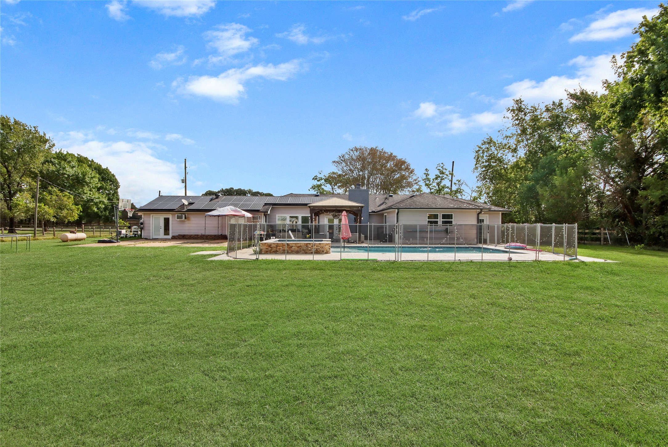 The spacious backyard offers room to relax, play, and entertain, all set on this expansive lot.