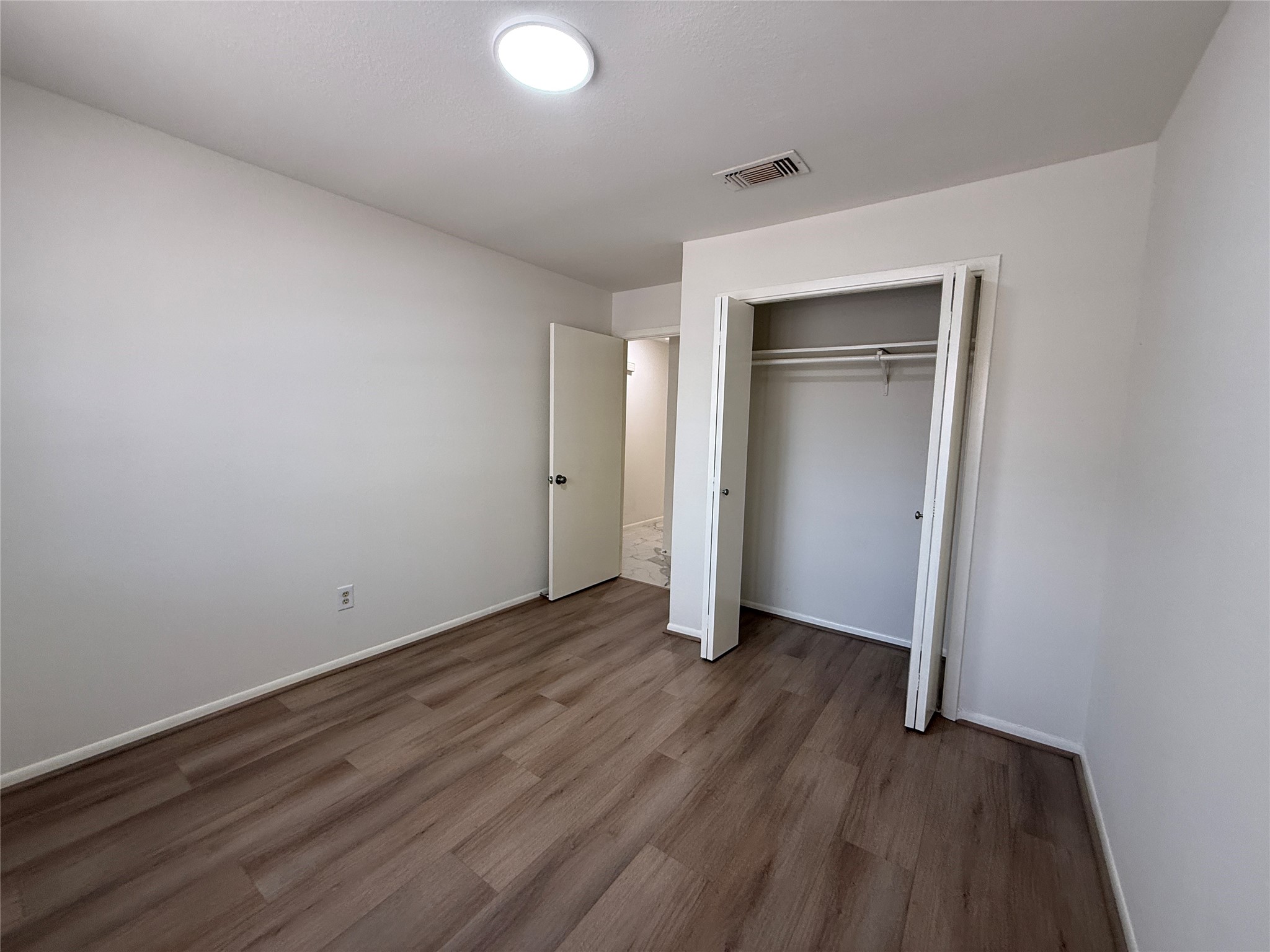 Vinyl floor in the second bedroom.