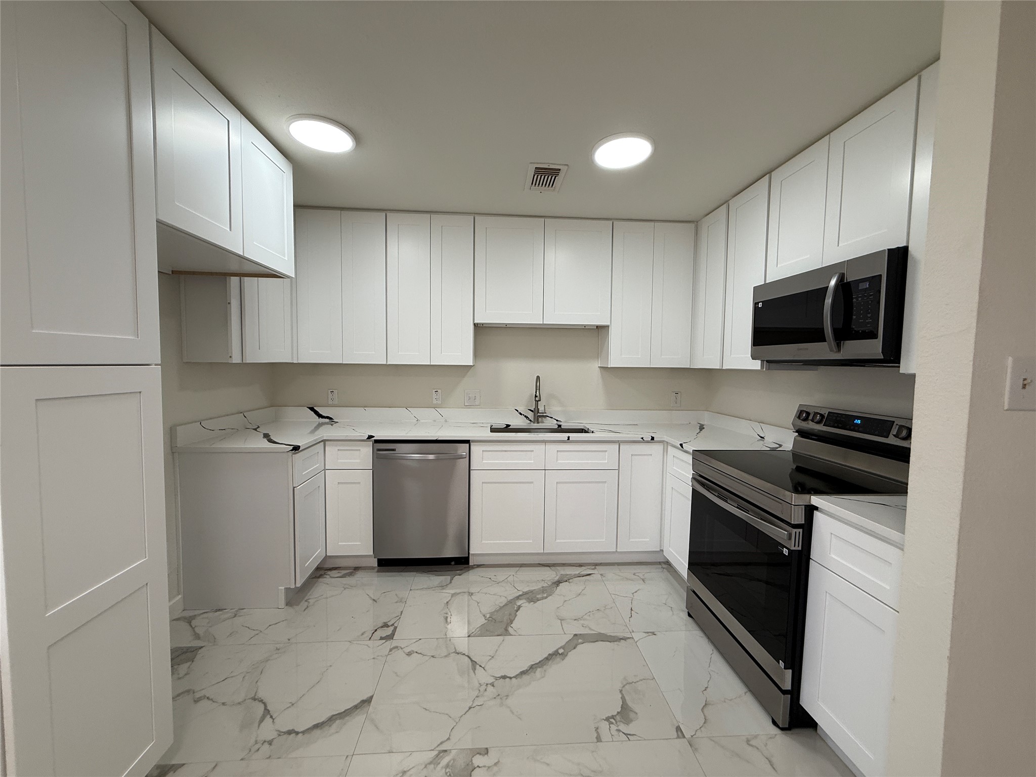 Kitchen with new cabinets and appliances. Kitchen with new cabinets and appliances.
