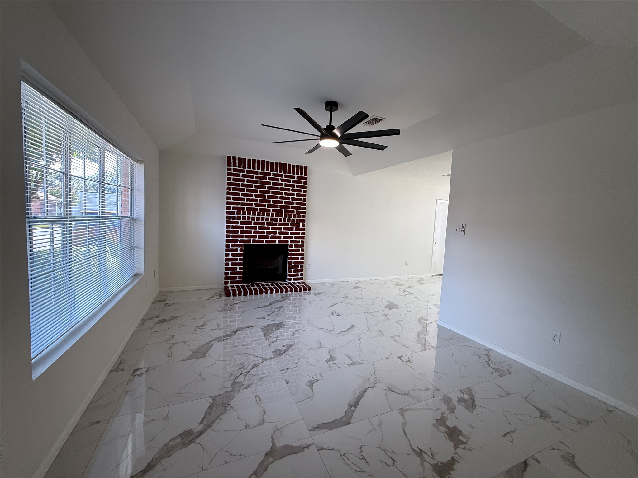 Living room with wood burning fireplace. Living room with wood burning fireplace.