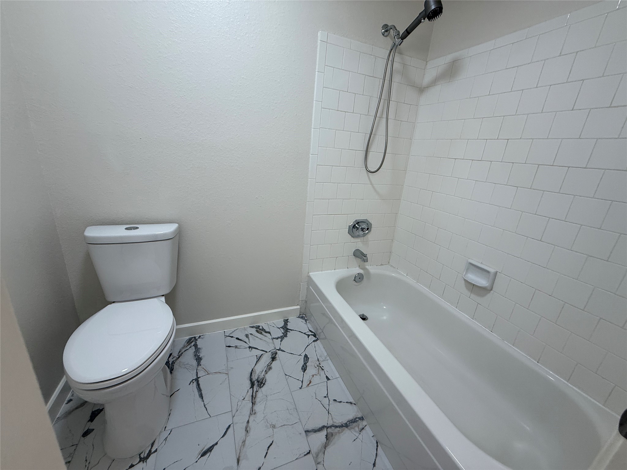 Primary bathroom with new flooring.
