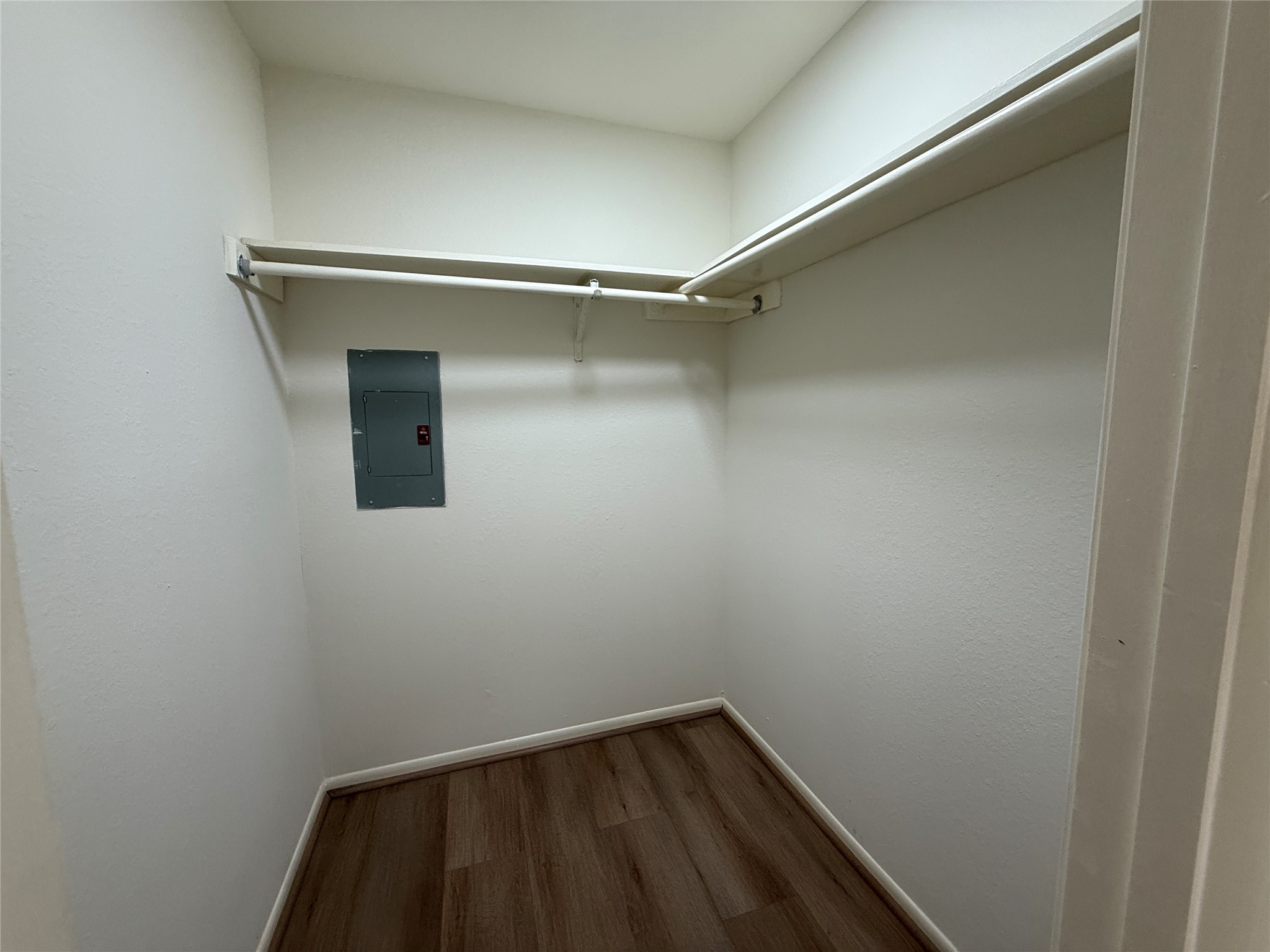 Walk in closet in primary bathroom.