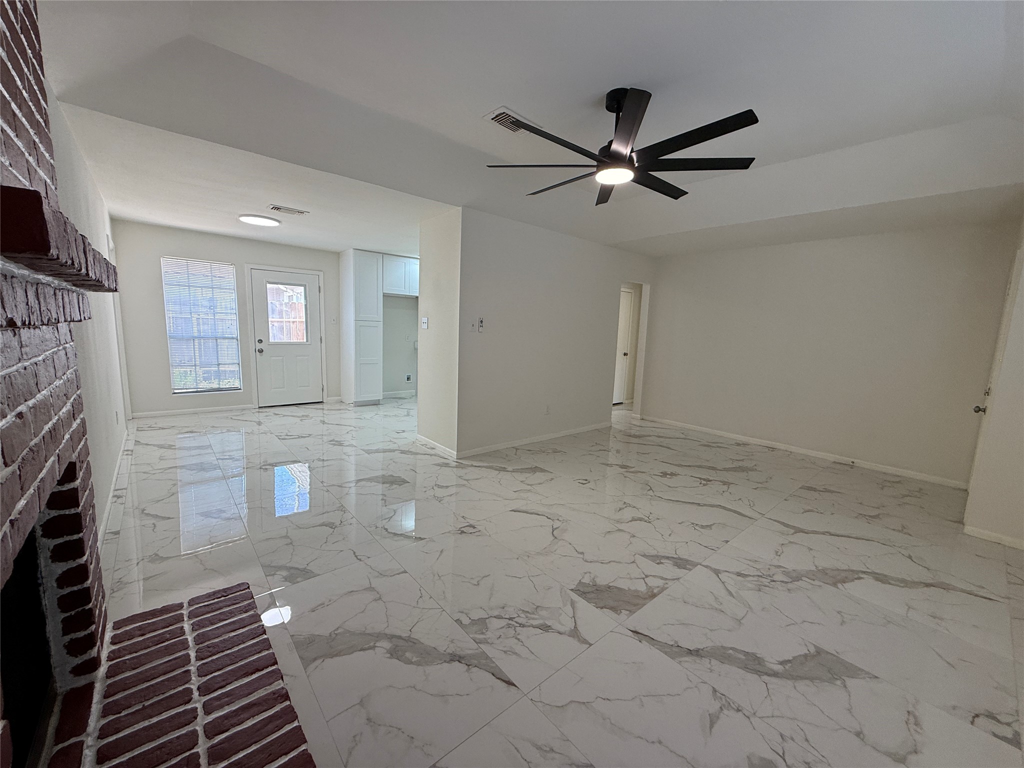 Living are looking towards kitchen and dining area. Living are looking towards kitchen and dining area.