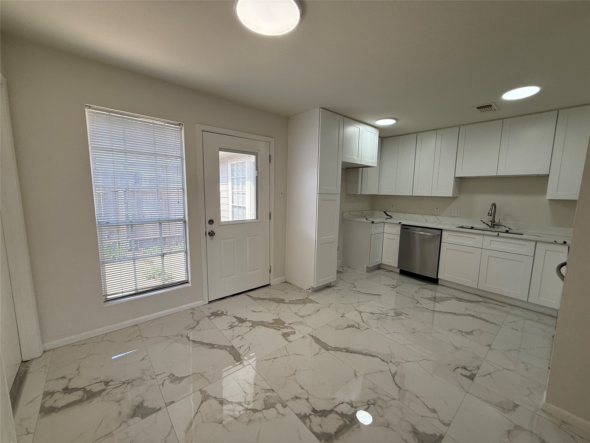 Dining area with access to the back patio. Dining area with access to the back patio.