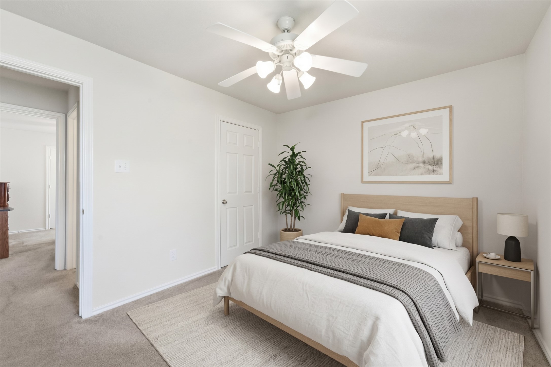 The third additional bedroom offers a versatile space perfect for a guest suite or home office, highlighted by neutral tones and a bright overhead ceiling fan.