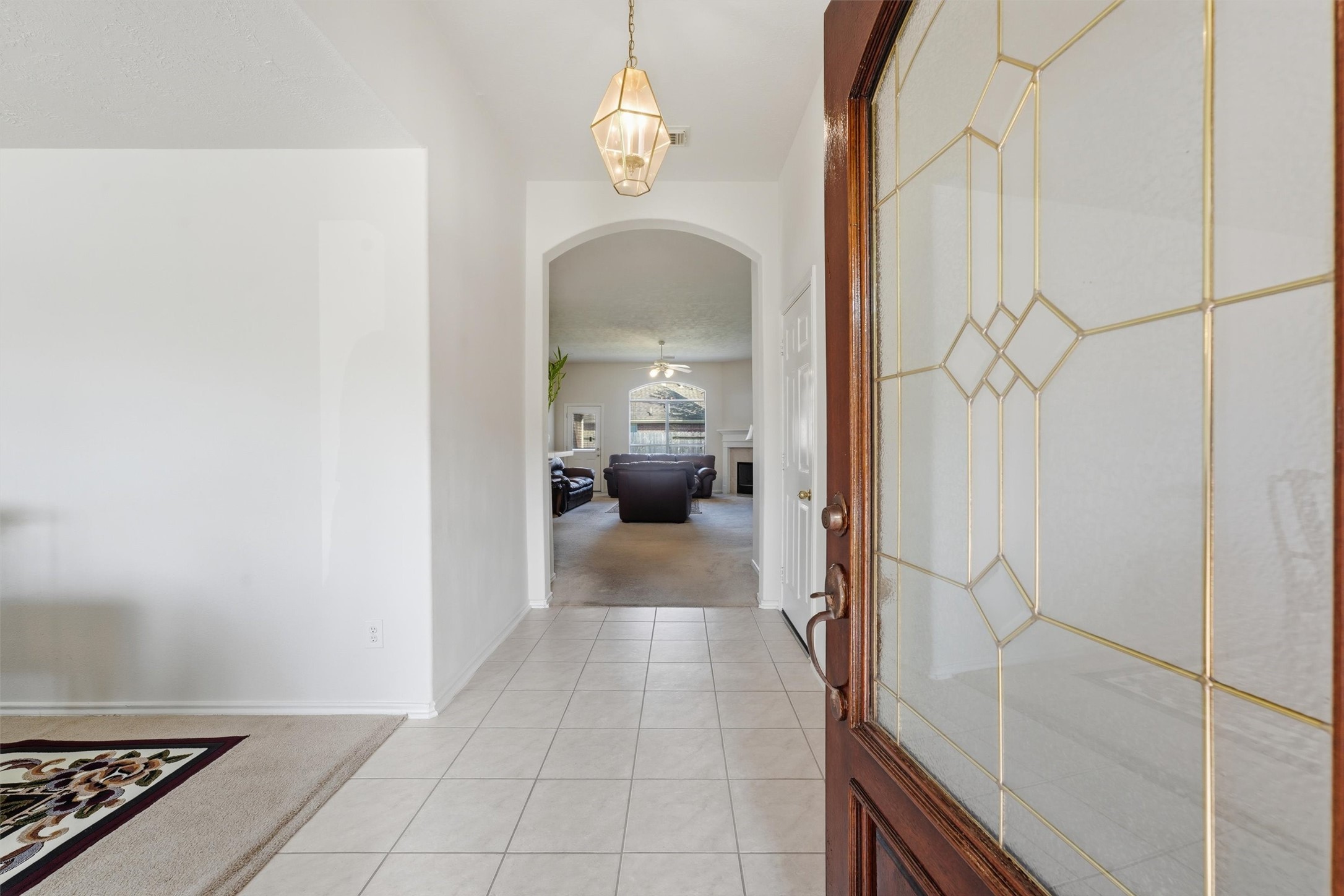Step through the inviting foyer that seamlessly guides you into the elegant formal dining room and cozy living room, perfect for entertaining and relaxation.