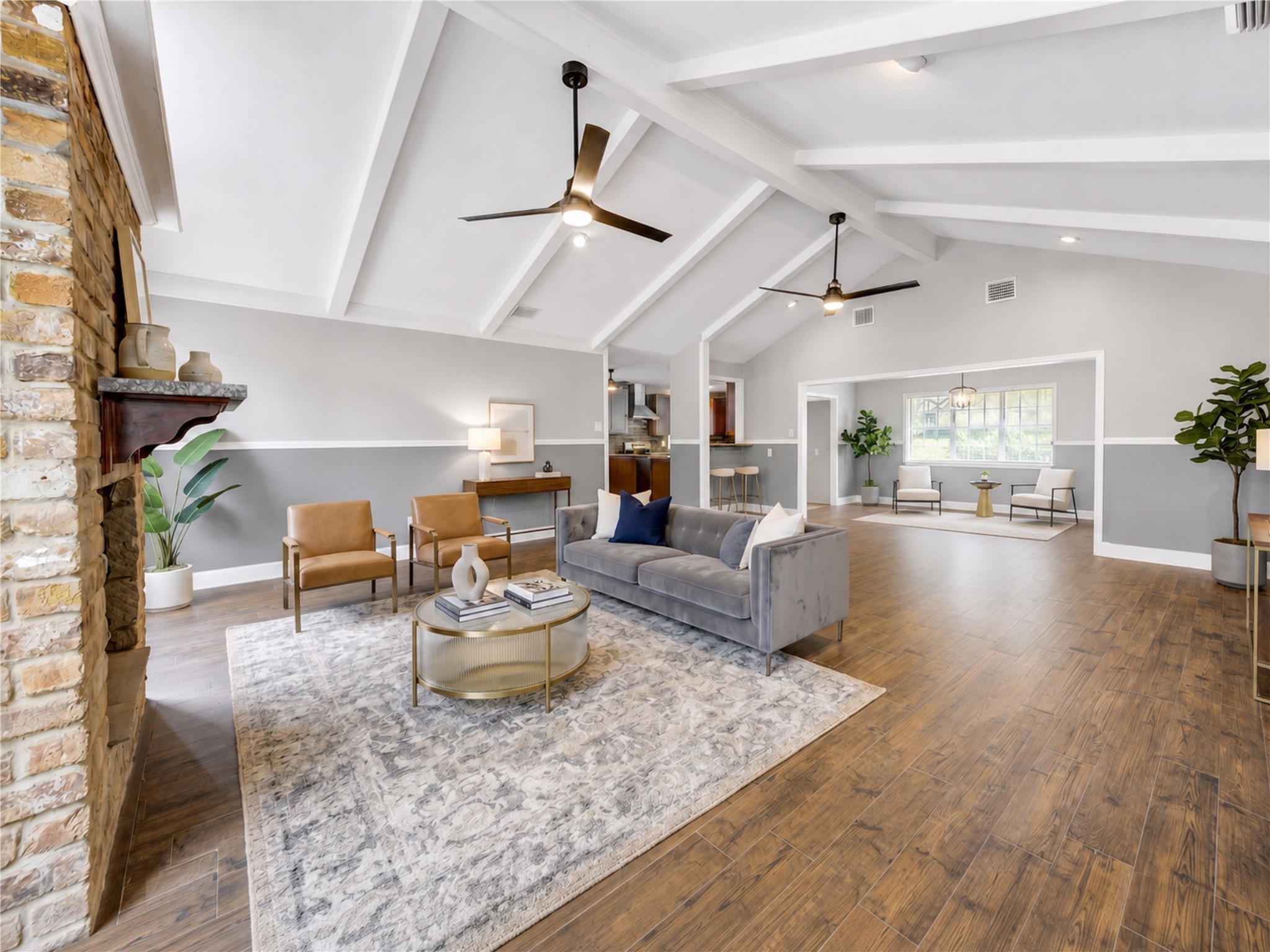 Spacious Living Room with Vaulted Beamed Ceiling - AI staging