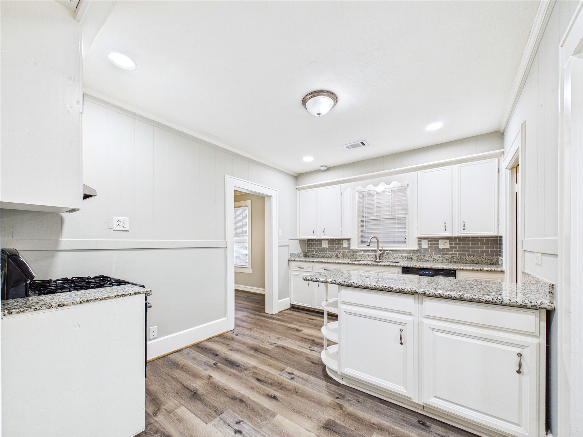Renovated kitchen with gas stove