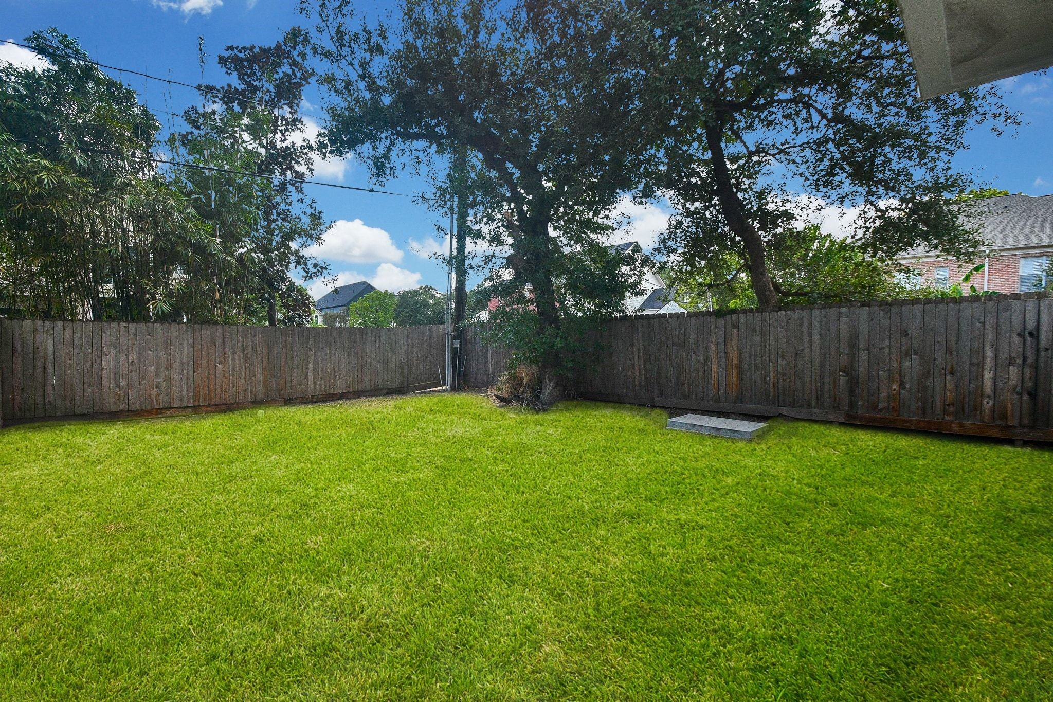 Here's another full view of your tremendous green lawn and privacy fencing surrounding the back property. Here's another full view of your tremendous green lawn and privacy fencing surrounding the back property.