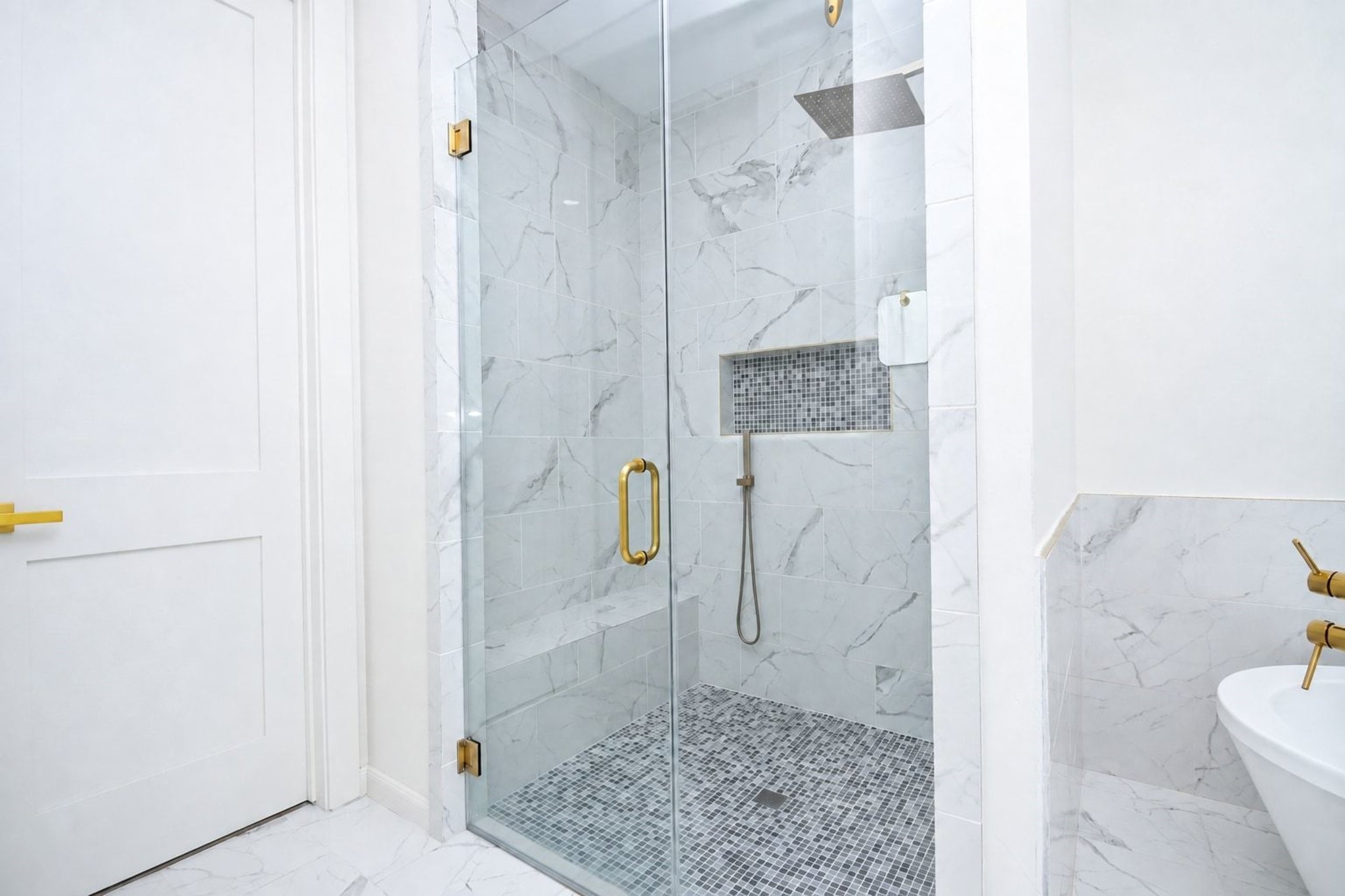 Your primary walk-in, glass enclosed shower provides spacious room to stretch and relax!