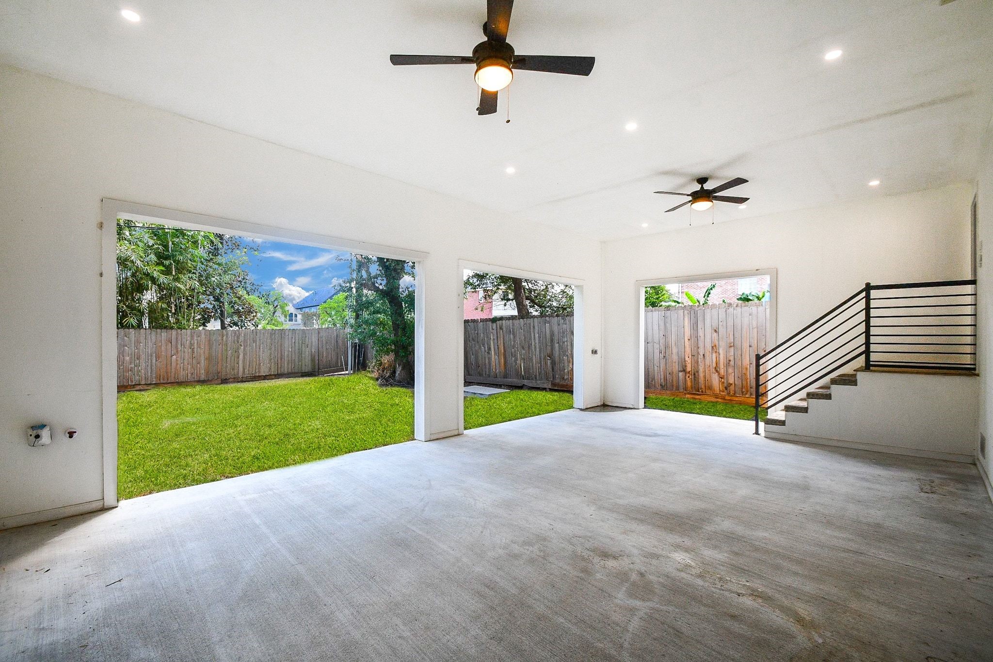 Your huge backyard patio will provide shelter rain or shine! Spacious covered patio features gas hookups built into the far left wall for convenient outdoor grilling, with ceiling fans, recessed lighting and views of the fenced backyard. Durable epoxy fills the floor. Your huge backyard patio will provide shelter rain or shine! Spacious covered patio features gas hookups built into the far left wall for convenient outdoor grilling, with ceiling fans, recessed lighting and views of the fenced backyard. Durable epoxy fills the floor.