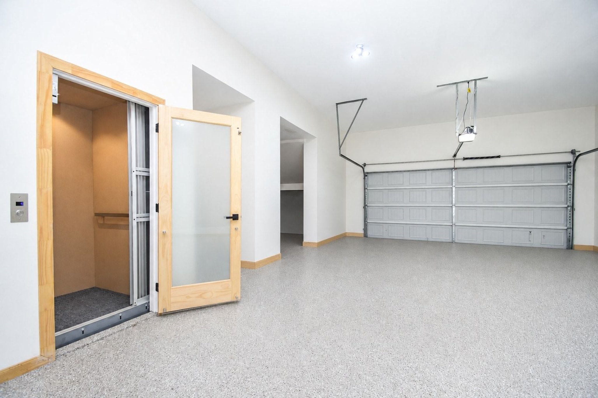 The four car garage is huge and spotless with epoxy flooring and extra storage space. Access to Elevator.