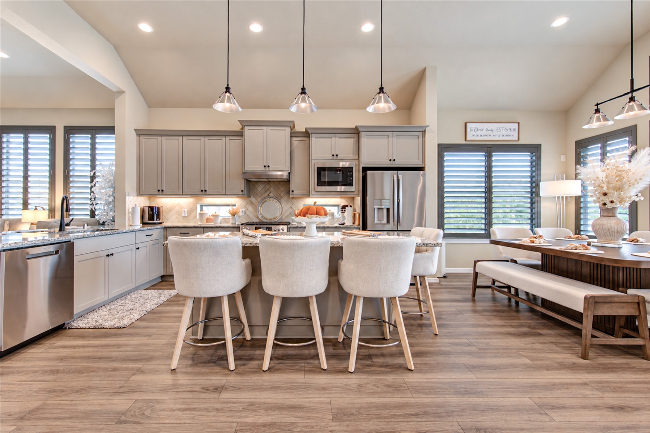 A well-designed kitchen with a spacious island, abundant cabinetry and a seamless connection to the family room.