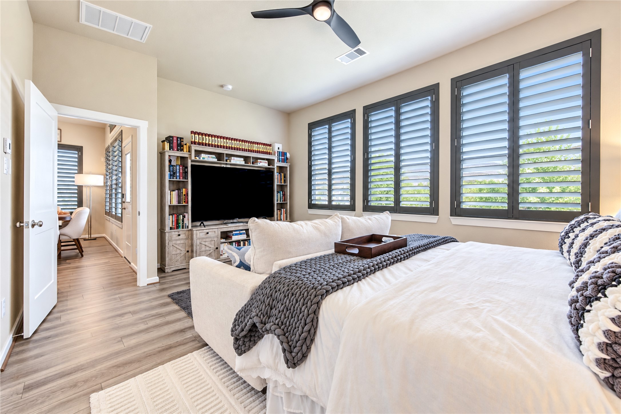 Another view of the primary suite, highlighting its generous proportions and beautiful windows.
