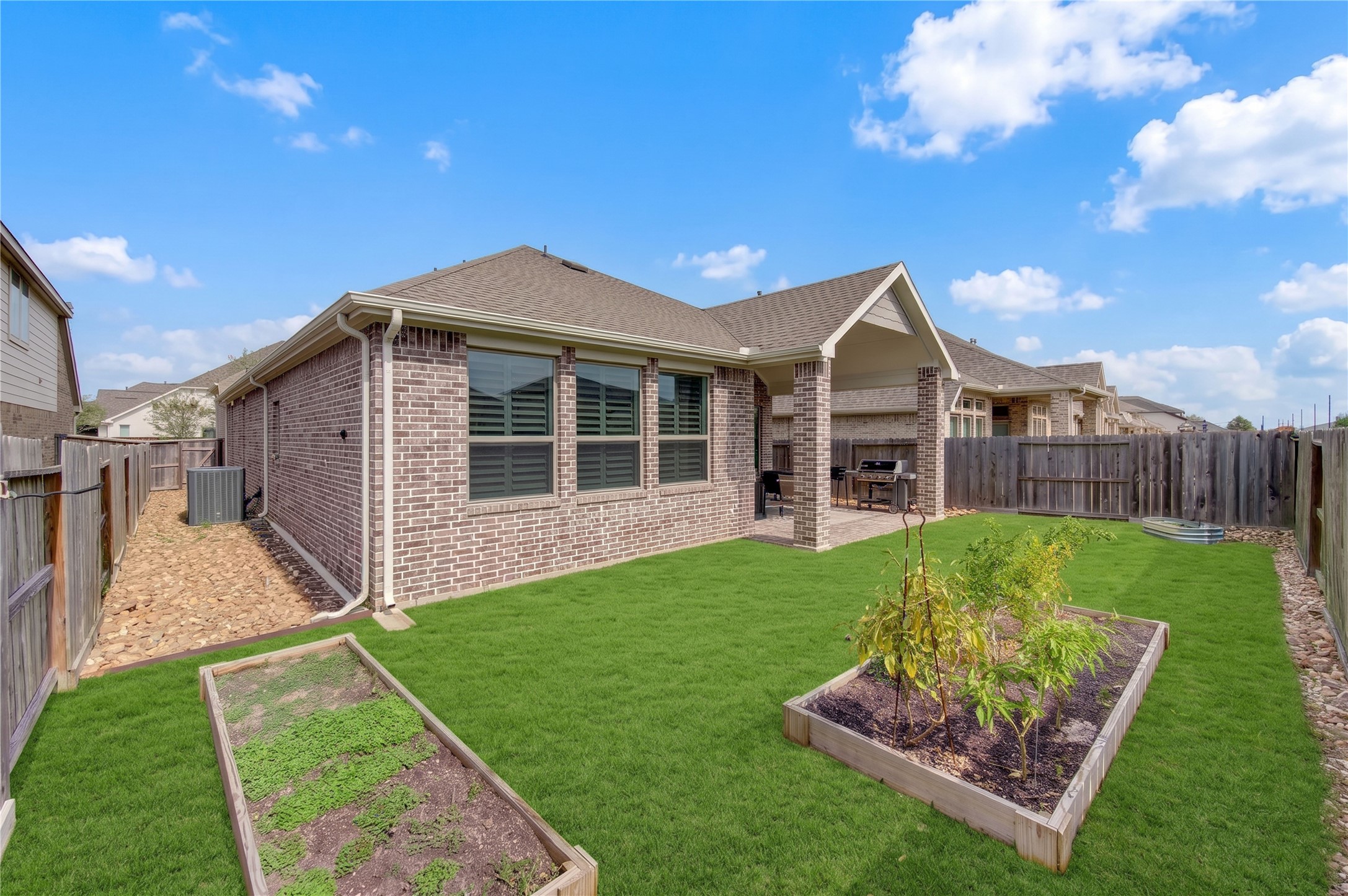A spacious backyard with room to enjoy outdoor living, gardening or play.