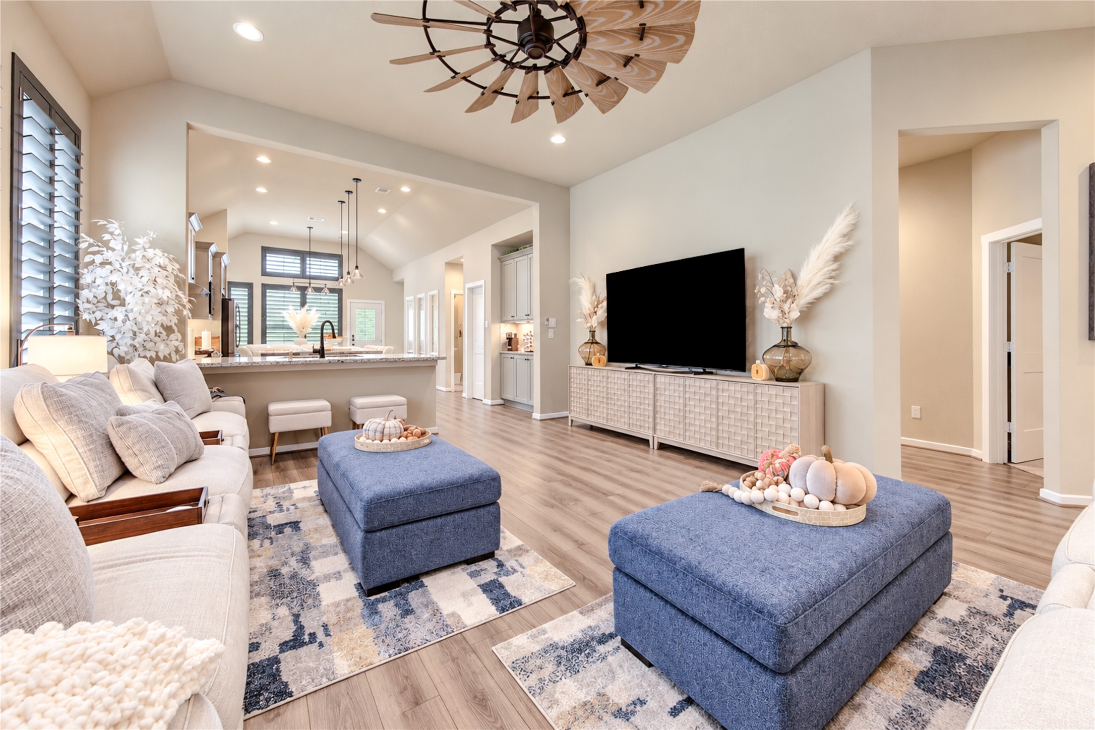 Another perspective of the family room, highlighting the generous space, high ceilings and easy flow into the kitchen.