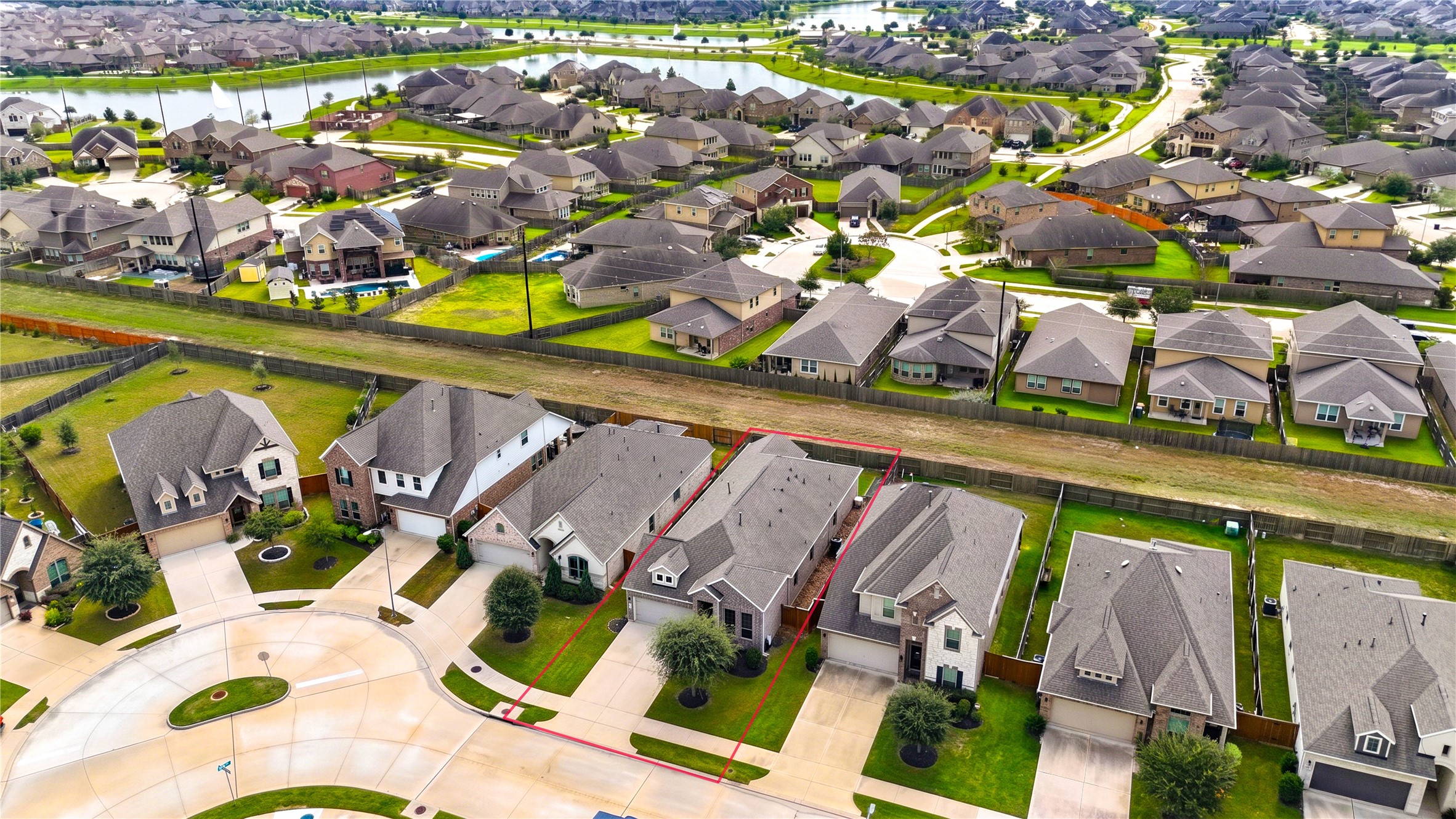 A wider perspective of the surrounding neighborhood, with established residential streets and nearby green spaces.