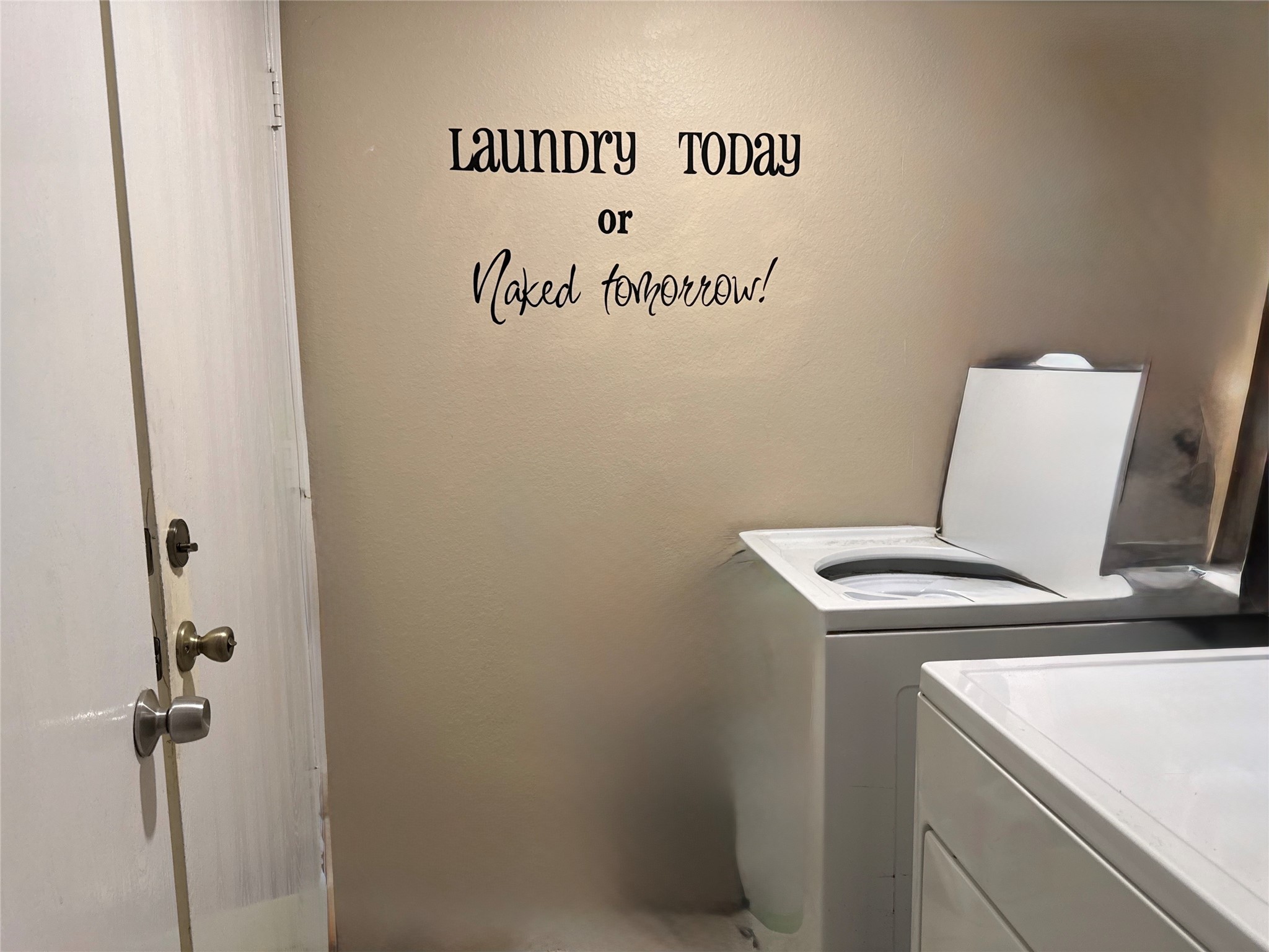 Dedicated laundry room with included washer and dryer provides convenient access to the two-car garage.