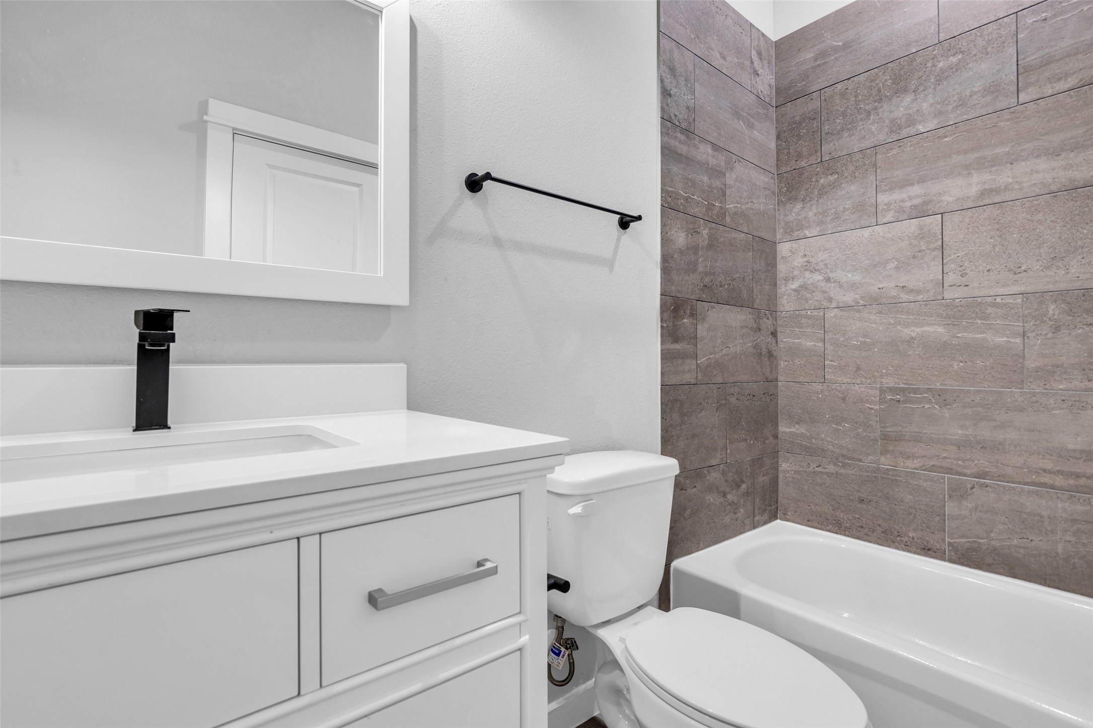 A hall bath with a tub/shower combo, conveniently near the secondary bedrooms.