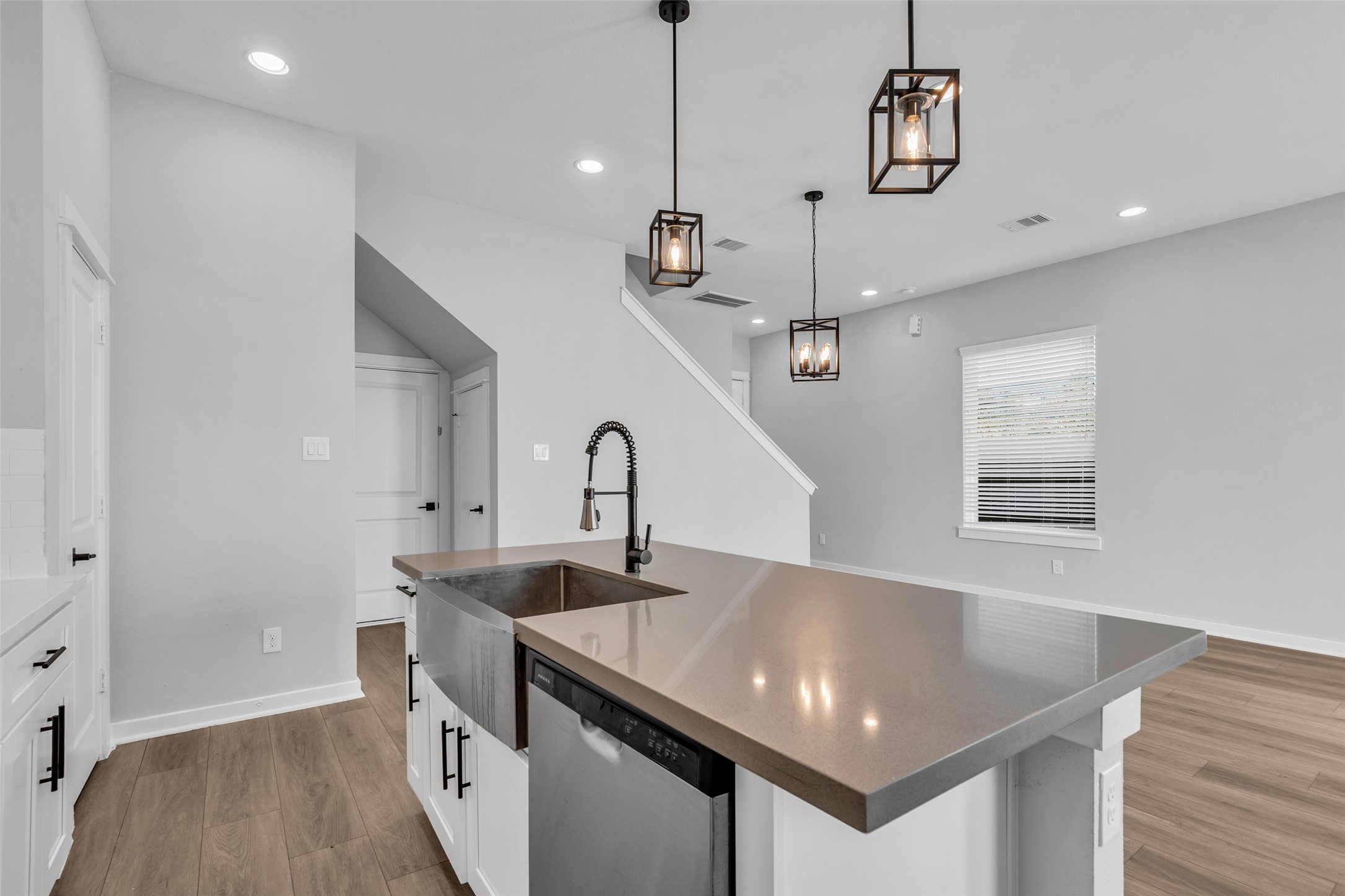 Clean up without missing the conversation, with the sink and dishwasher right at the island, open to the living area.
