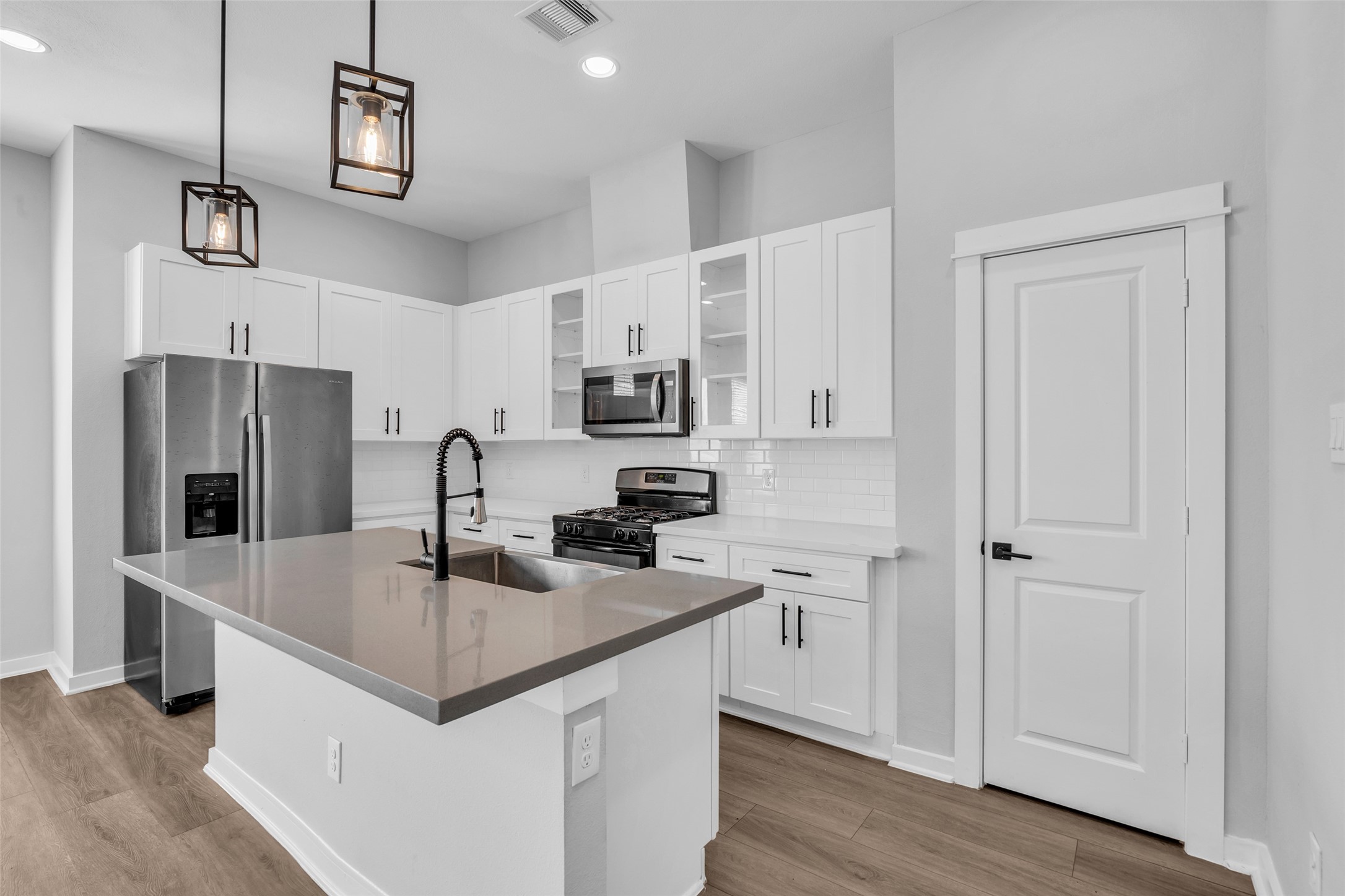 Prep, serve and chat at the oversized island, with the gas range just steps away.