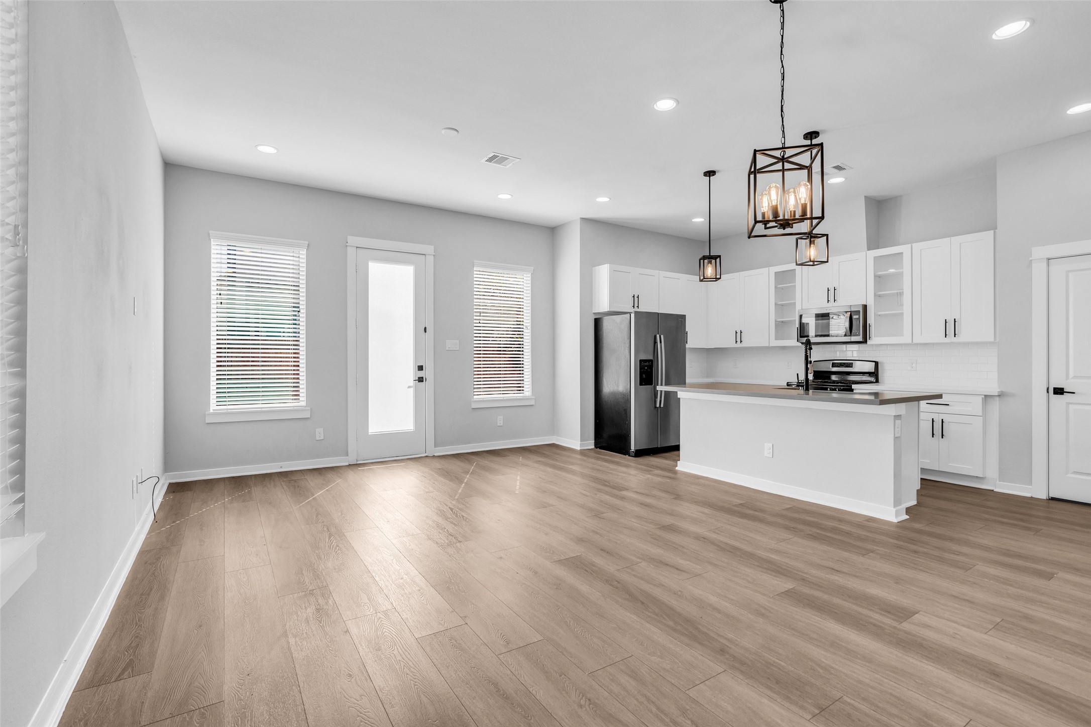 Open sightlines from the living room to the kitchen keep everyone connected while you cook. Open sightlines from the living room to the kitchen keep everyone connected while you cook.