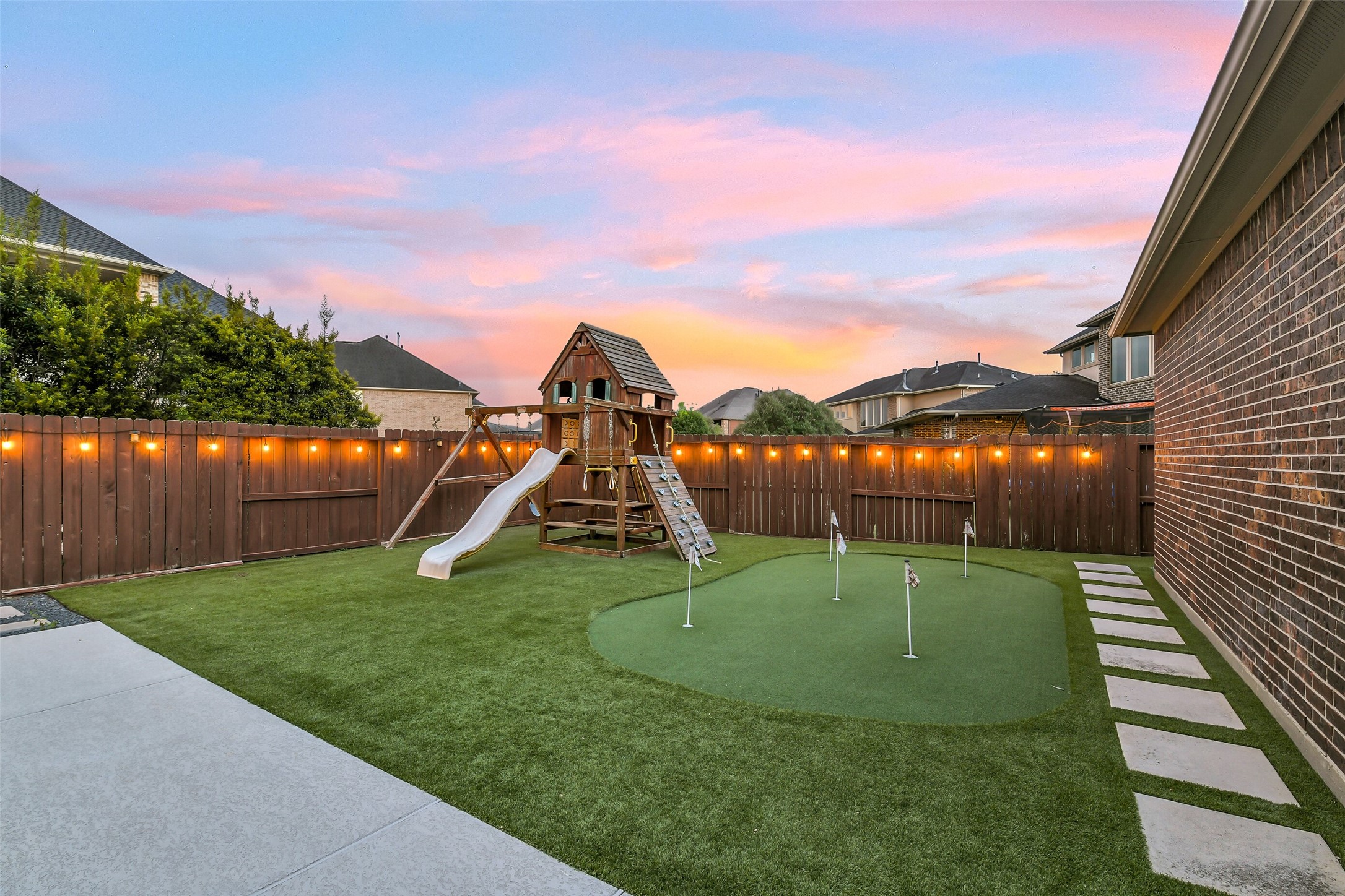Enjoy your very own custom putting green and expansive green space for recreation, play, and pets