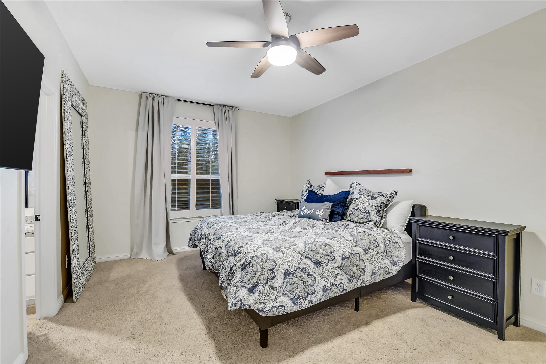Inviting upstairs secondary bedroom with an ensuite bathroom, ideal for guests or family.