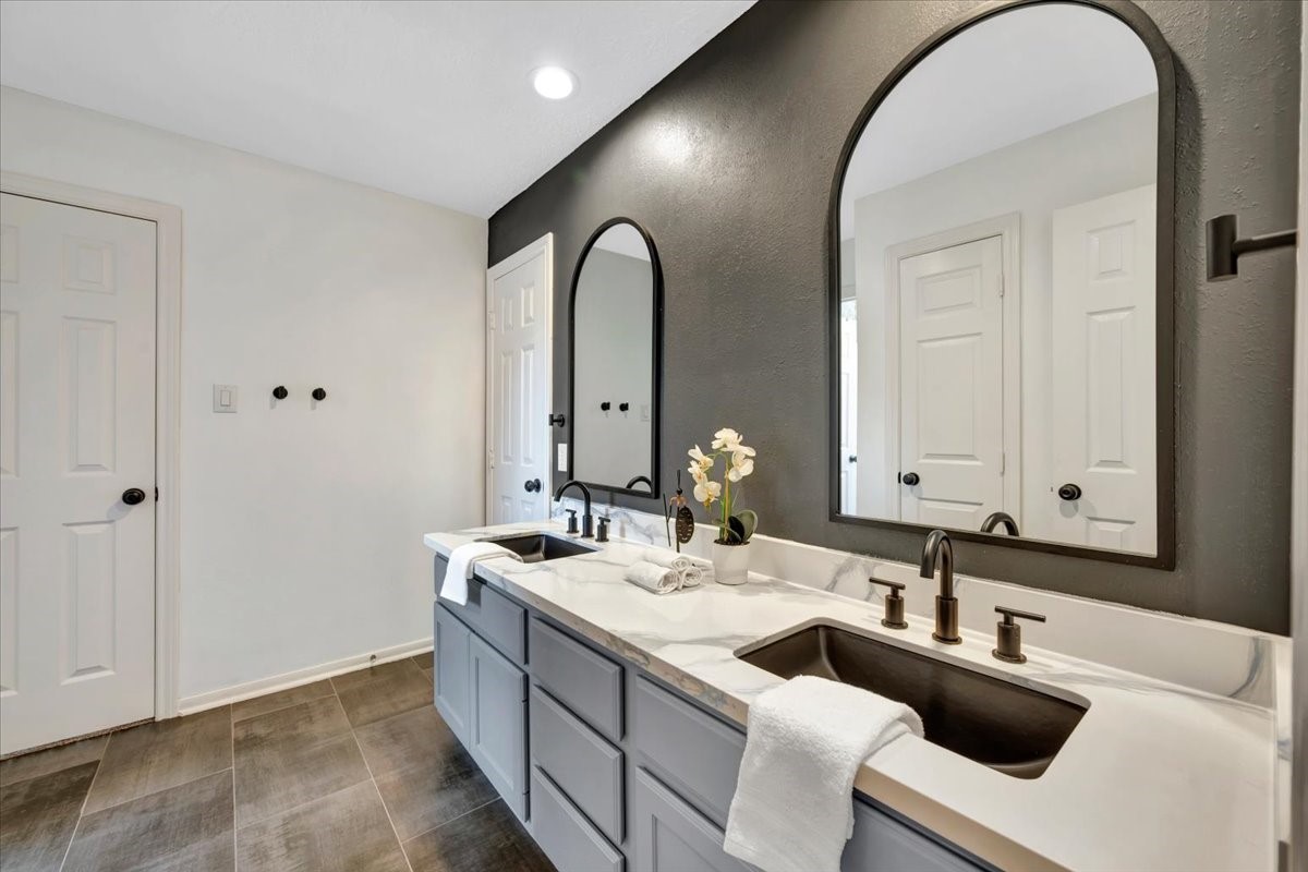 Upstairs full bathroom with dual-sink vanity area.