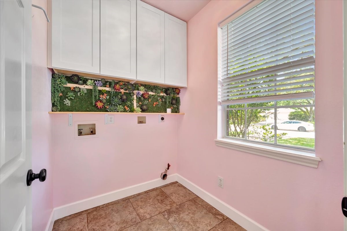 Recently remodeled laundry room with charming personal touches.