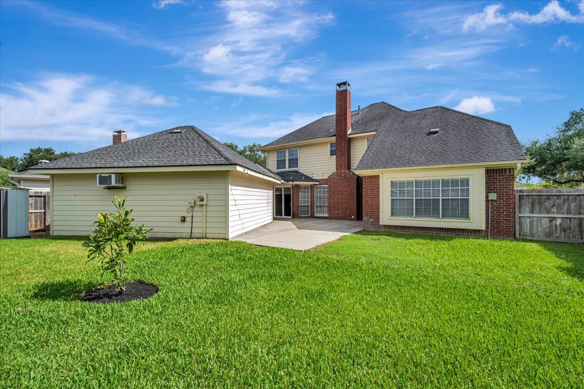 Backyard perspective showing the homes outdoor living potential.