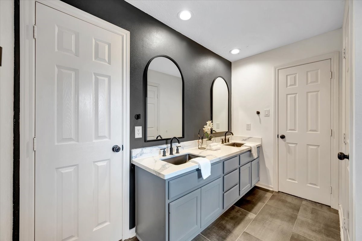Beautifully updated guest bathroom with direct access from both the game room and a secondary bedroom.