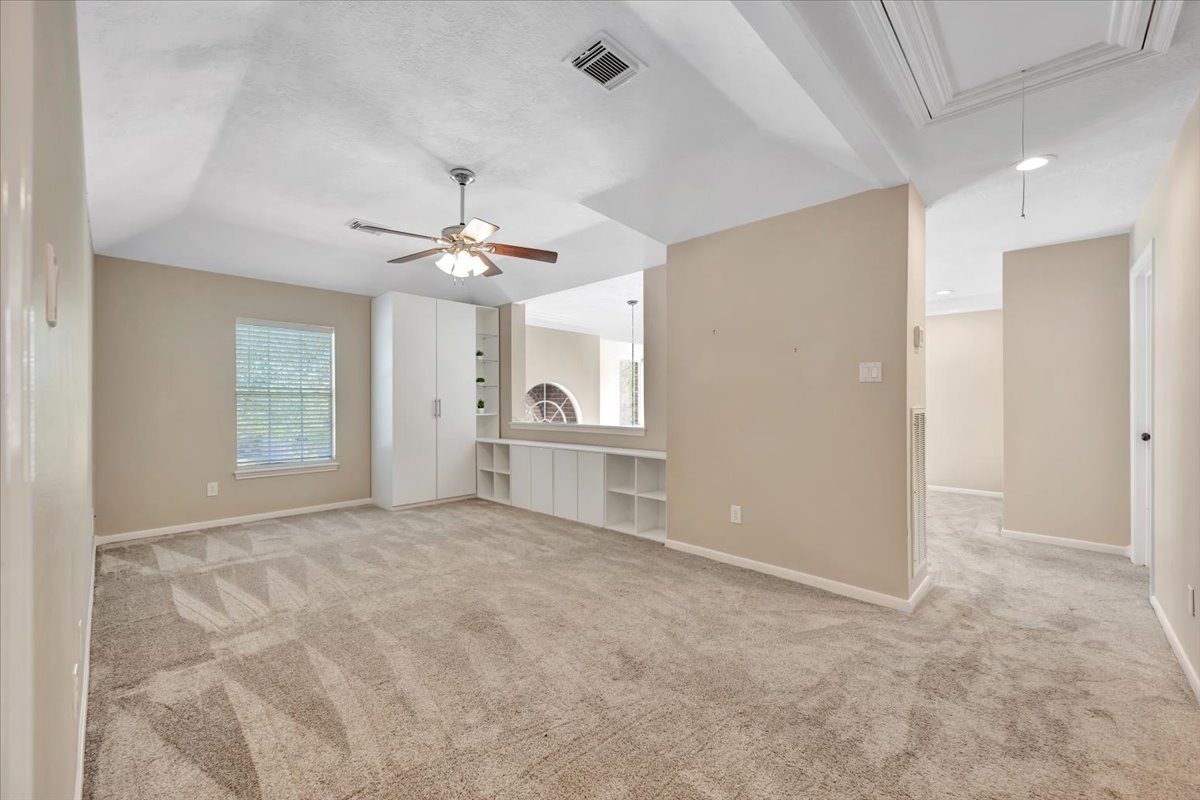 Upstairs game room offering flexible space for work, play, or media.