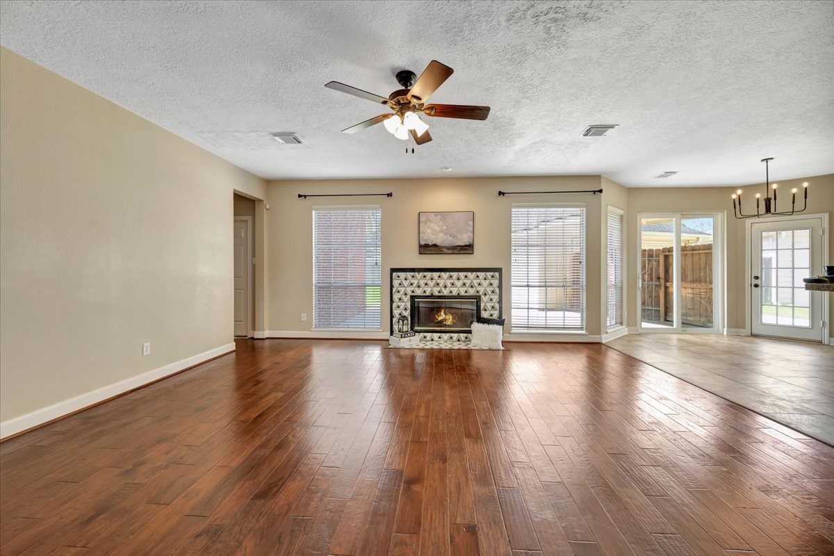 Elegant formal living room featuring a stunning updated fireplace with a marble surround and high-end finishes. Elegant formal living room featuring a stunning updated fireplace with a marble surround and high-end finishes.
