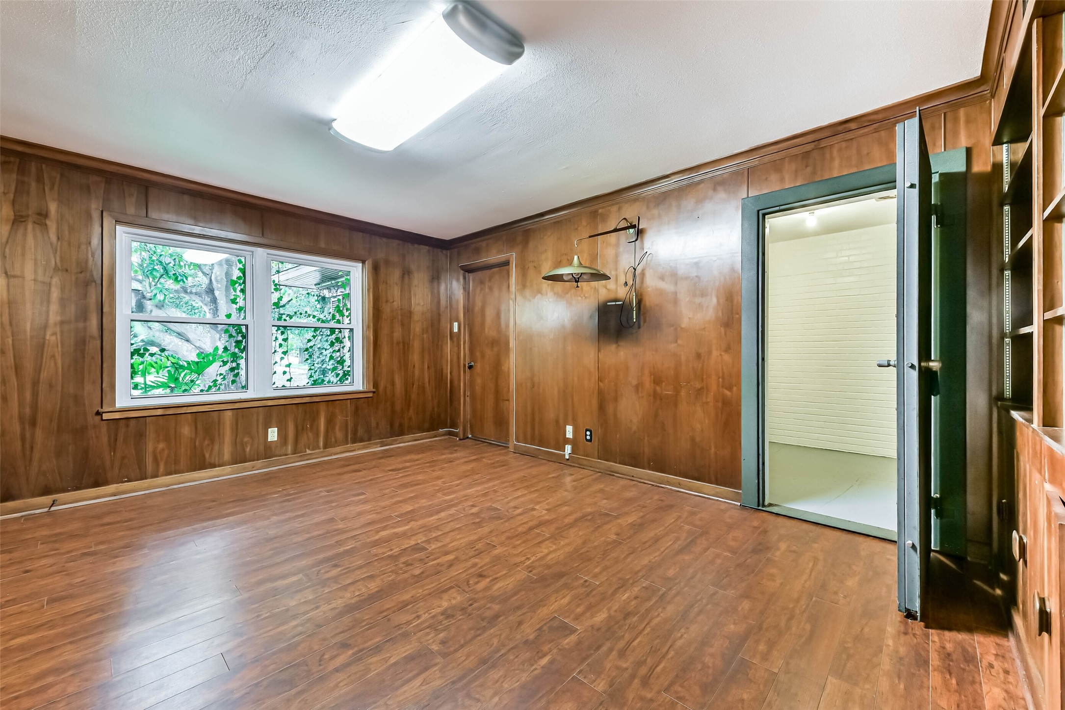 Private Office with an 8 x 8 vault, entrance to the vault on right, can be locked and unlocked, code available