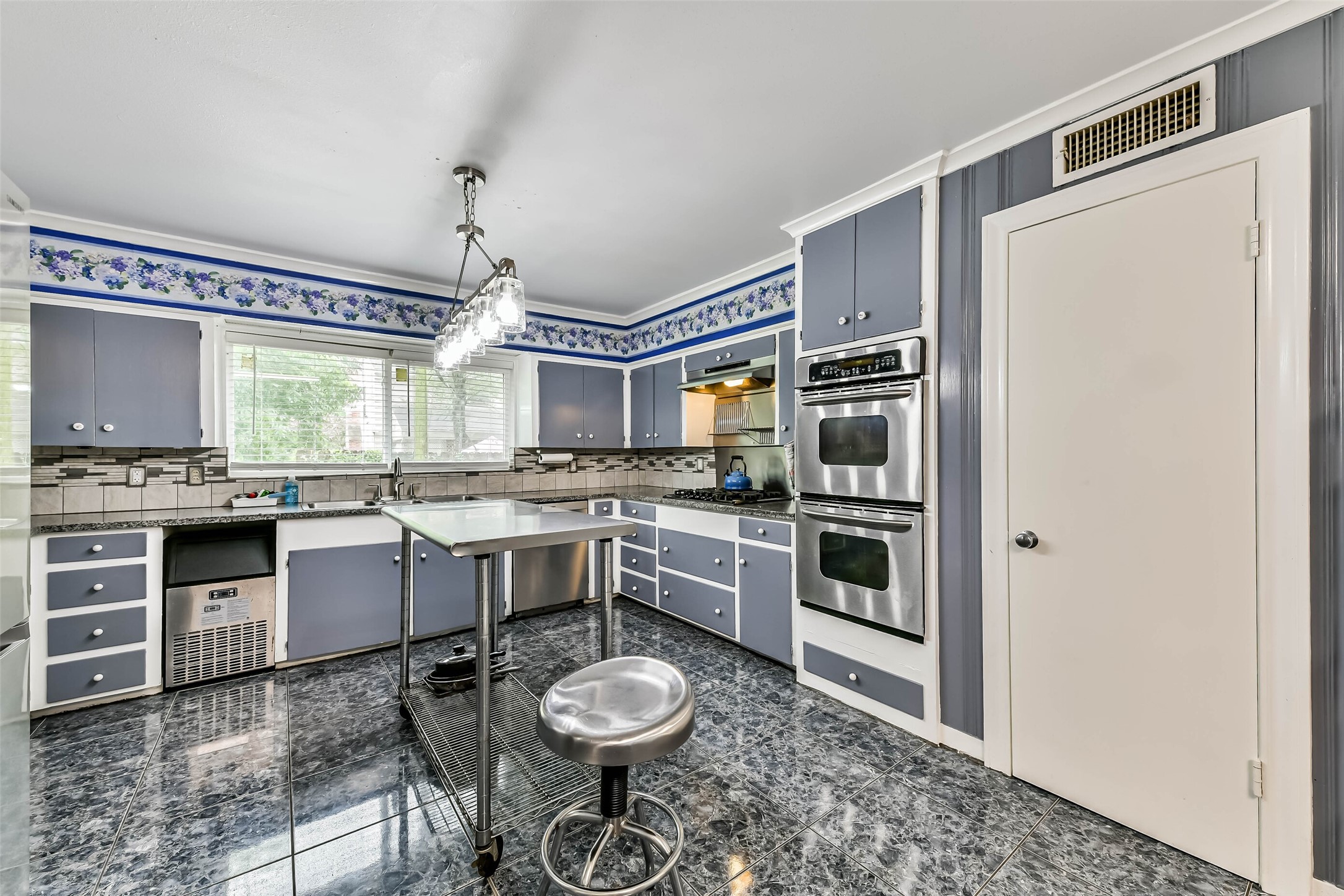 Another large walk in closet available for the kitchen as well.  Double Ovens, and gas stove top.