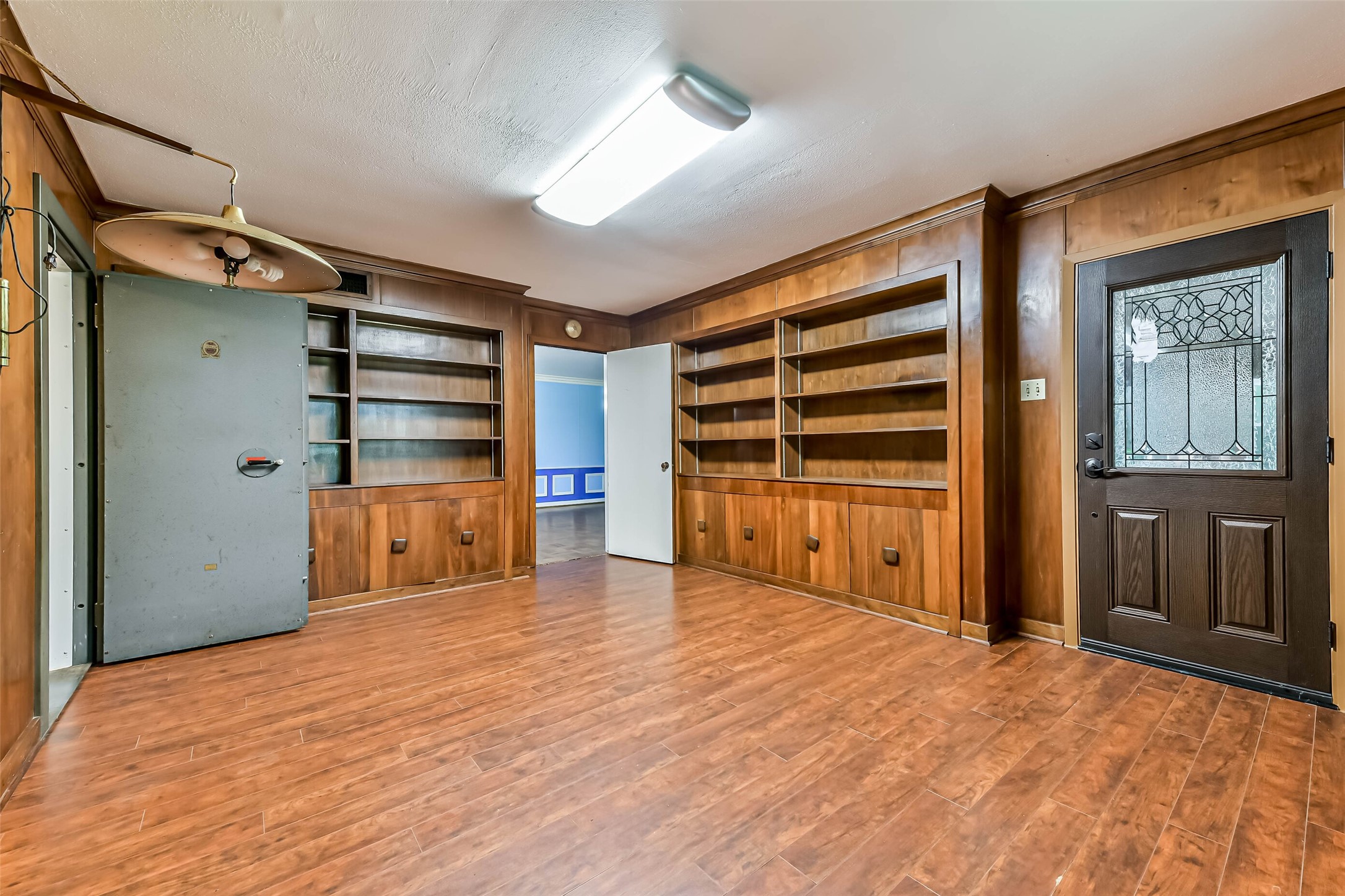 Another view of the private office, stain glass door which is new and windstorm certified has a private exterior  entrance to the office.  Office also has a door to the formal living and dining and the master bedroom
