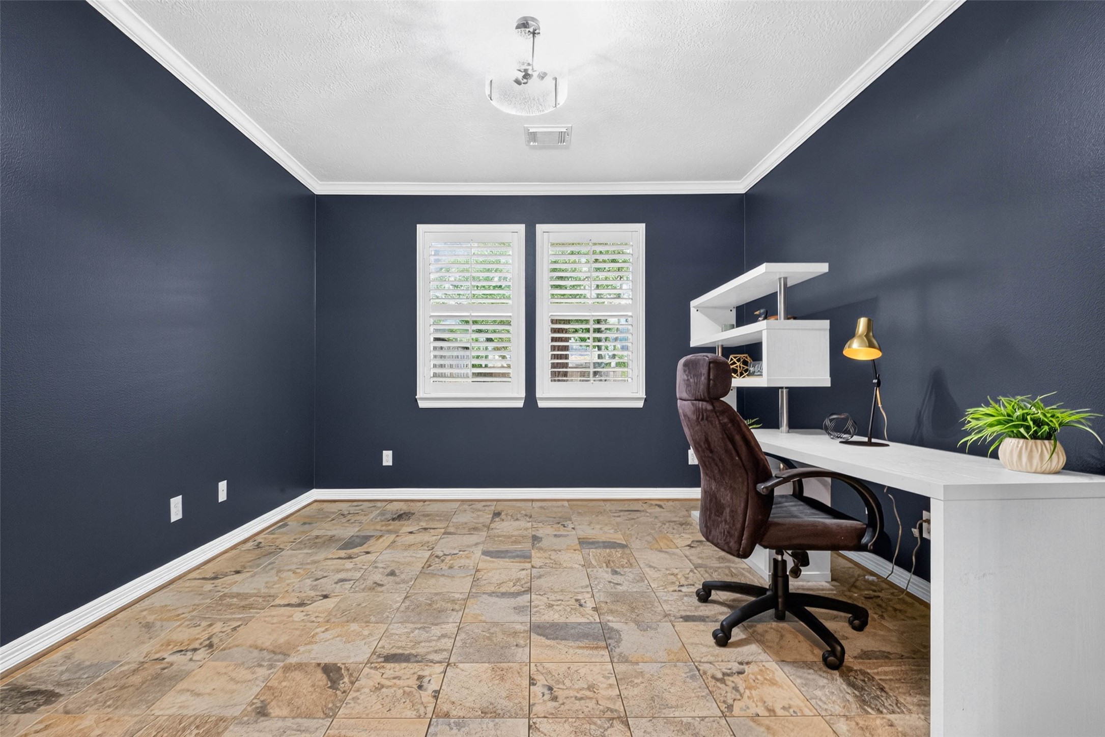 Home Office with slate tile flooring.