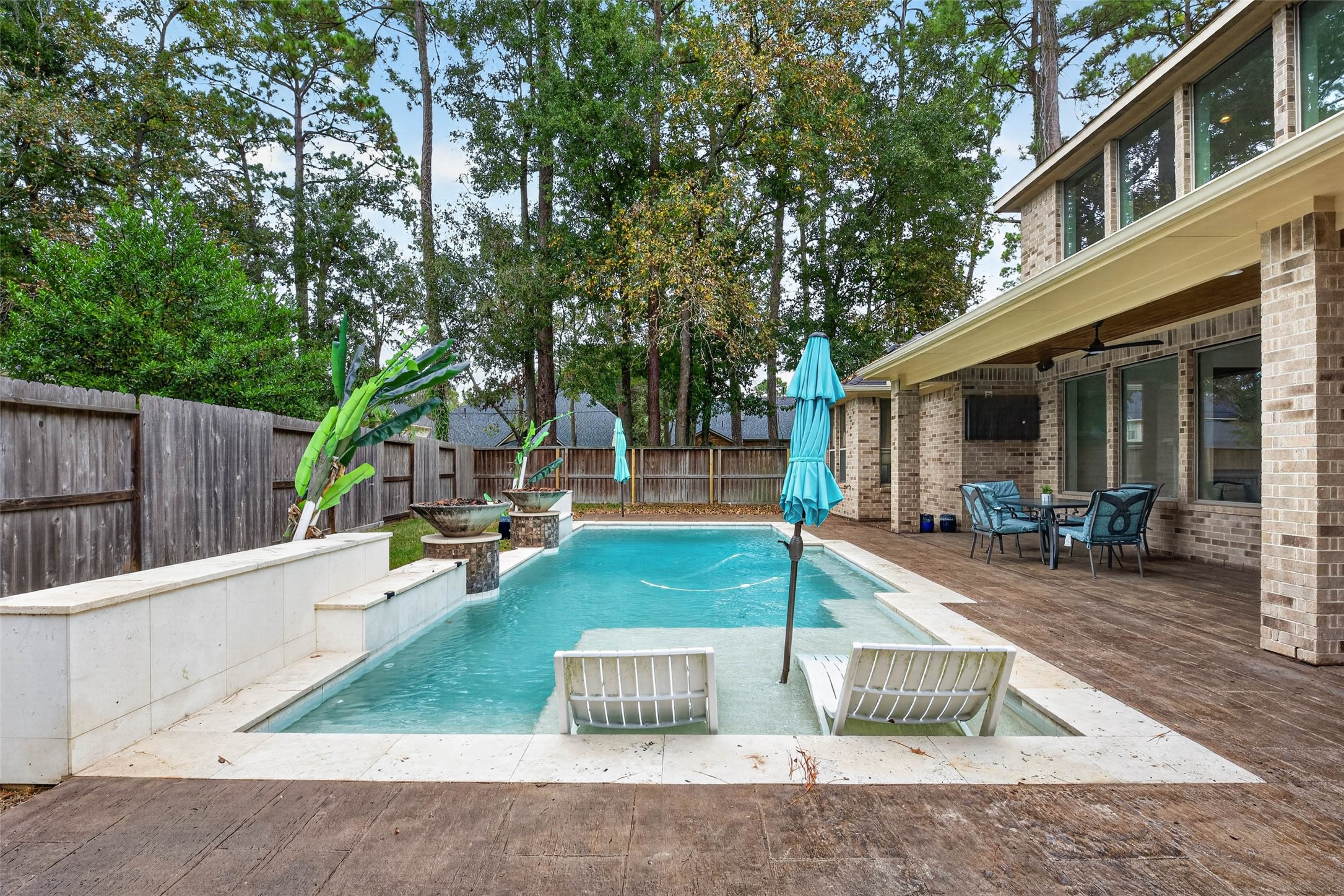 The two pool loungers are included.