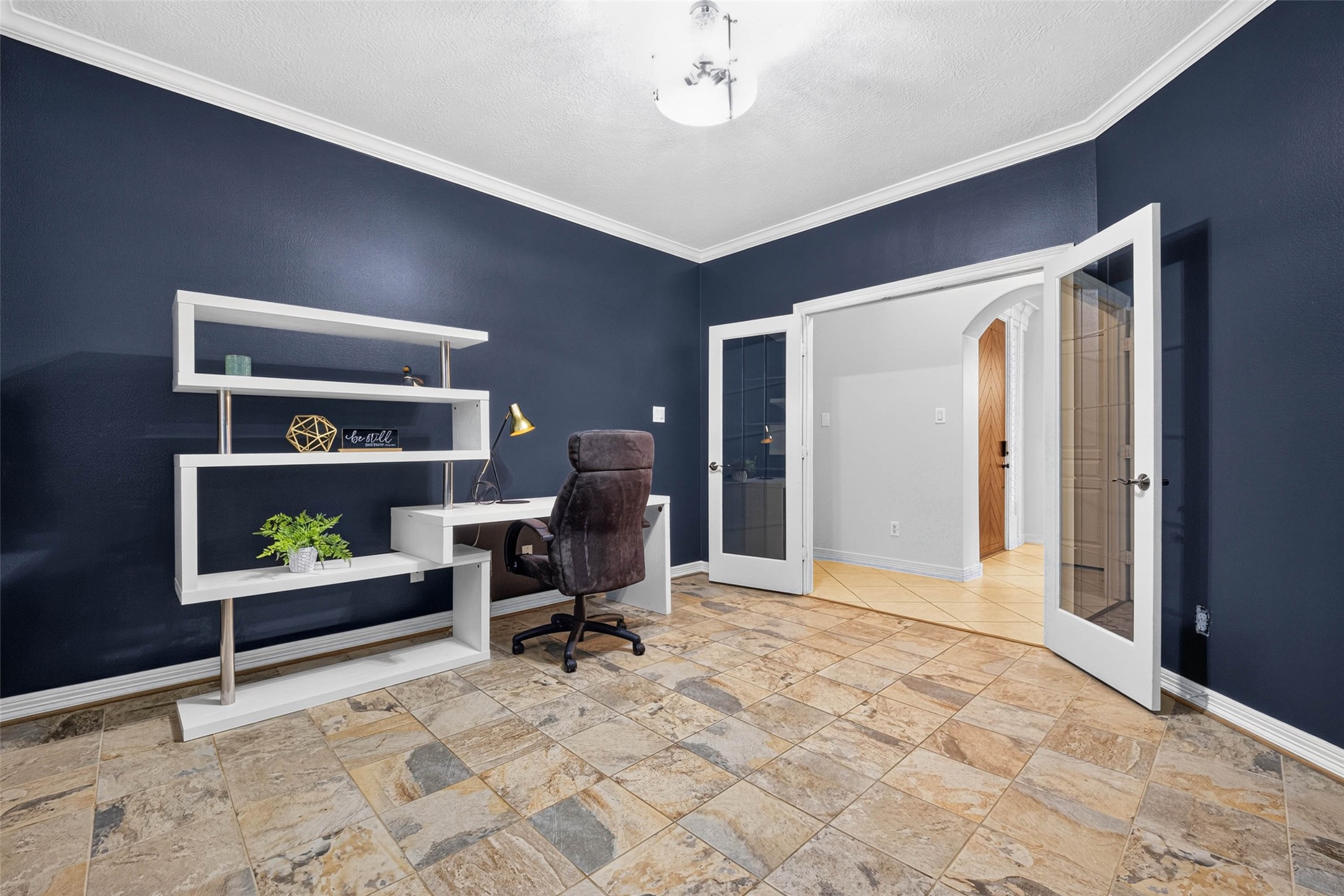 The home office has a set of French Doors for privacy.
