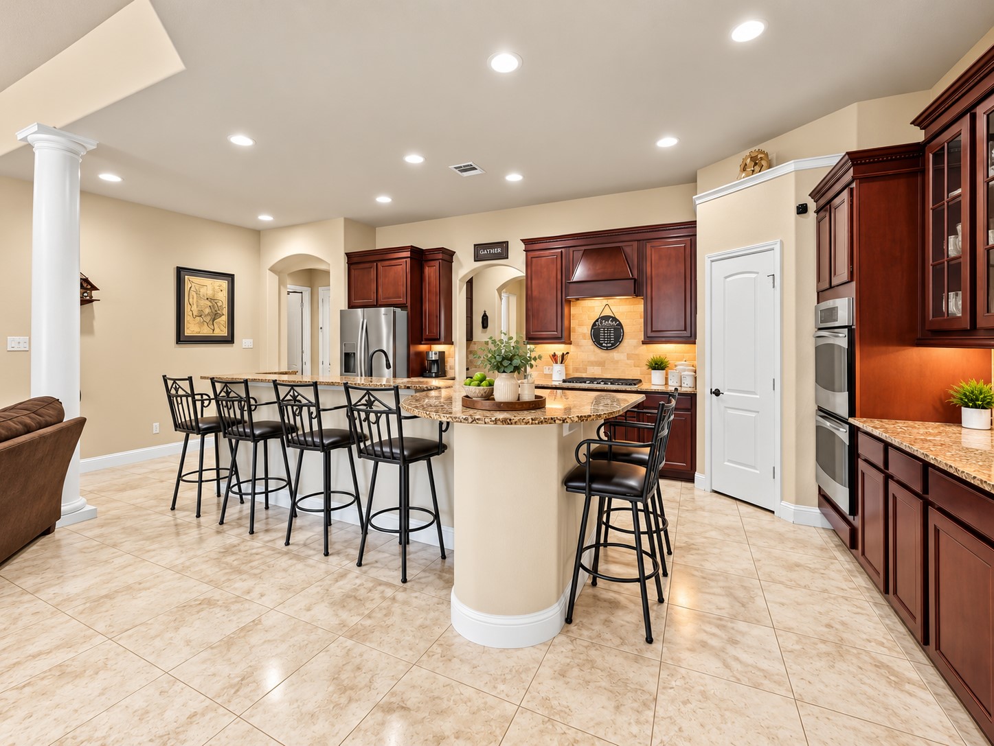 The kitchen combines everyday function with an open layout, featuring granite countertops, 42-inch cabinets, stainless steel appliances, and plenty of workspace. Whether it's a weeknight meal or a special occasion, the double ovens provide flexibility when you need extra cooking space.