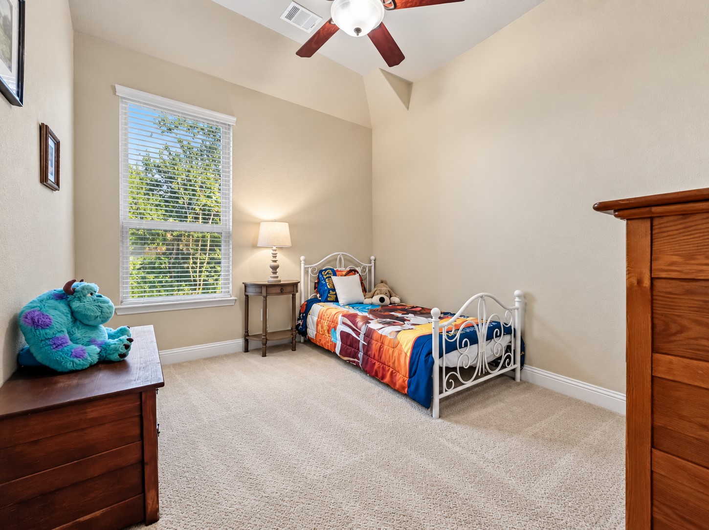 This generously sized bedroom offers a comfortable retreat for family or overnight guests.