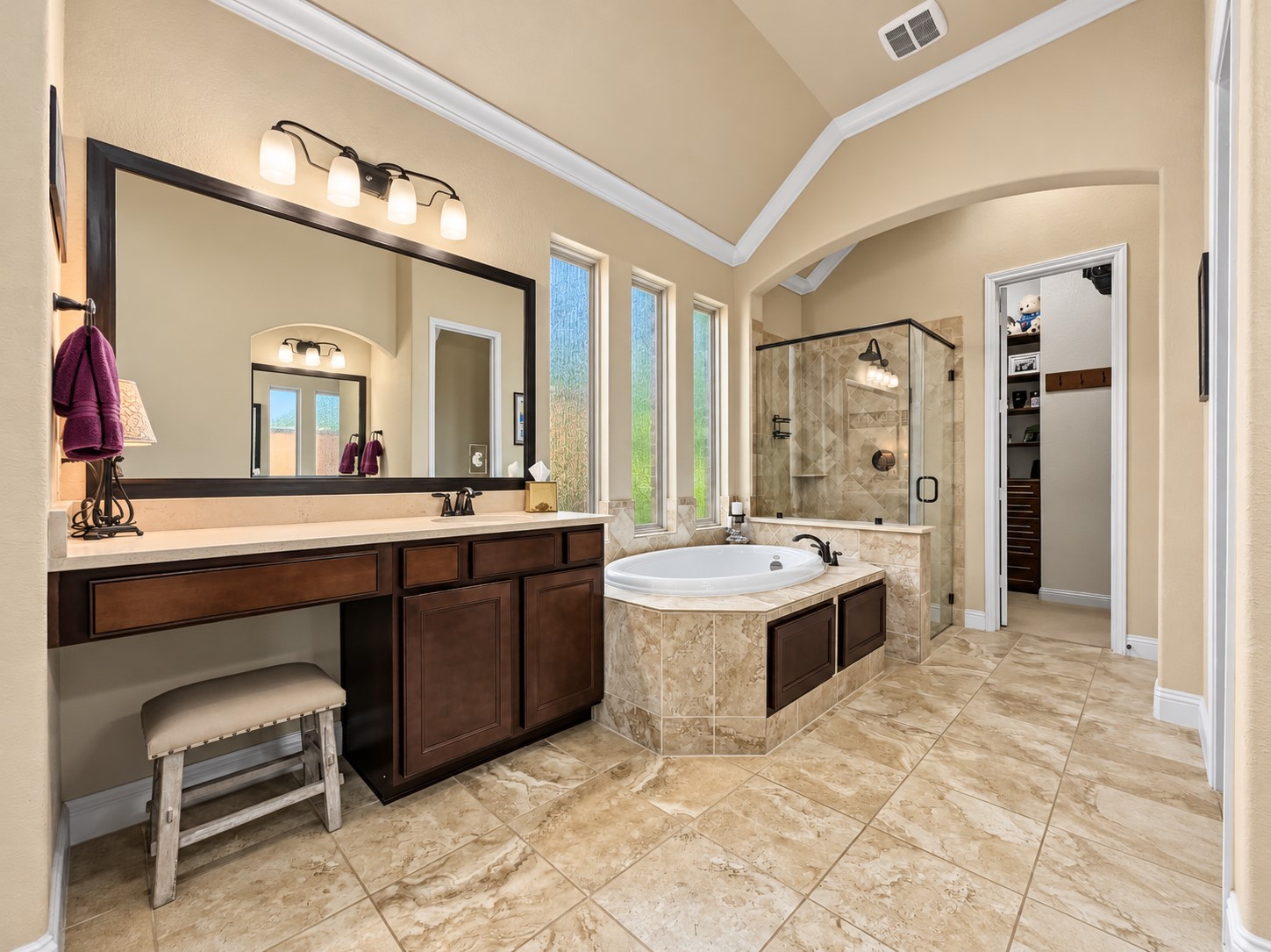 With two sinks and a dedicated vanity area, the bathroom offers practical space for getting ready without feeling rushed. Enjoy the best of both routines with a large soaking tub for relaxing evenings and a separate shower for busy mornings.